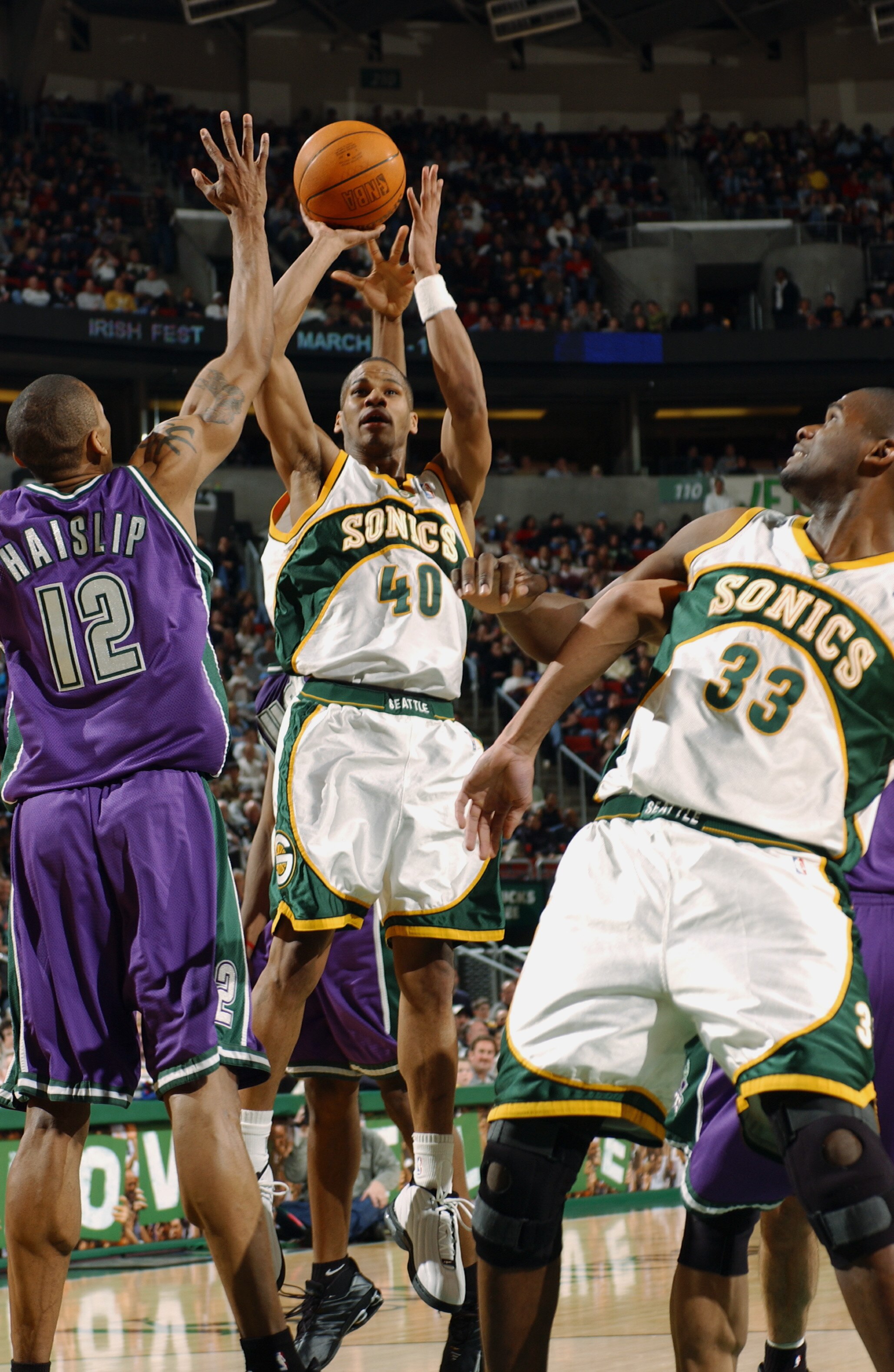 SEATTLE - FEBRUARY 21:  Joseph Forte #40 of the Seattle Sonics shoots over Marcus Haislip#12 of the Milwaukee Bucks during the game at Key Arena on February 21, 2003 in Seattle, Washington.  The Sonics won88-58.  NOTE TO USER: User expressly acknowledges