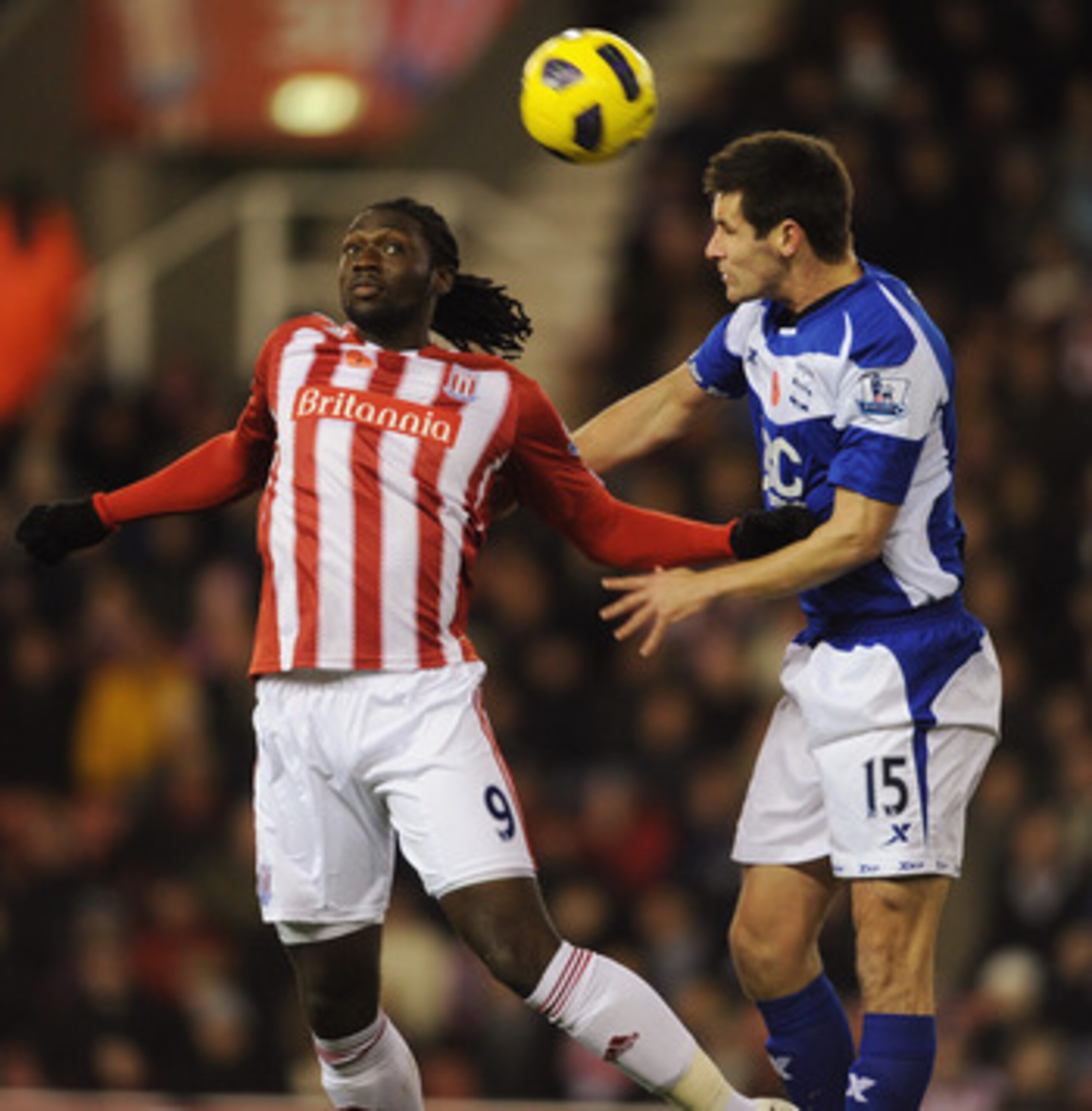 STOKE ON TRENT, ENGLAND - NOVEMBER 09:  Kenwyne Jones of Stoke in action with Scott Dann of Birmingham during the Barclays Premier League match between Stoke City and Birmingham City at the Britannia Stadium on November 9, 2010 in Stoke on Trent, England.