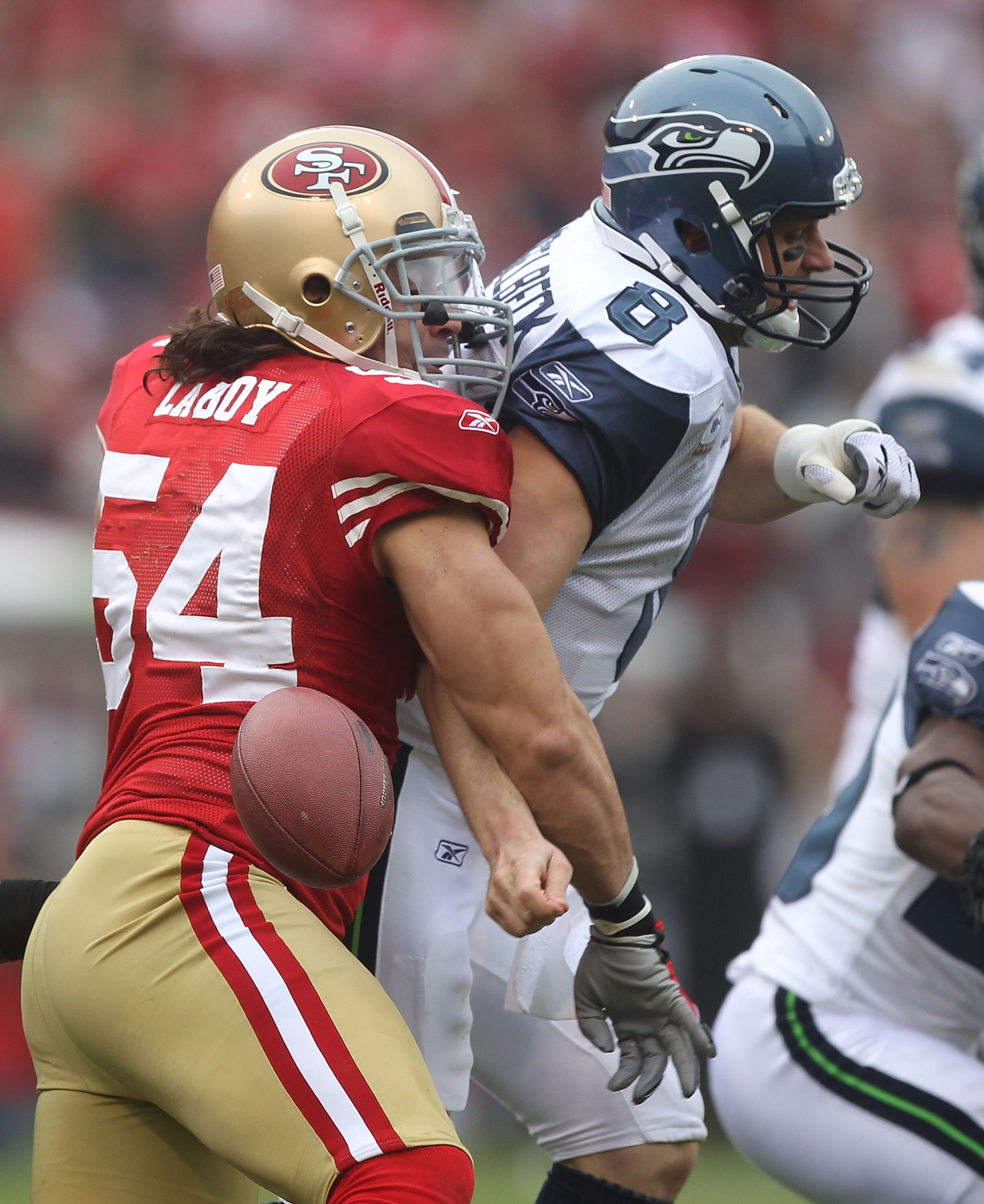 SAN FRANCISCO - DECEMBER 12:  Travis LaBoy #54 of the San Francisco 49ers sacks Matt Hasselbeck #8 of the Seattle Seahawks during an NFL game at Candlestick Park on December 12, 2010 in San Francisco, California.(Photo by Jed Jacobsohn/Getty Images)