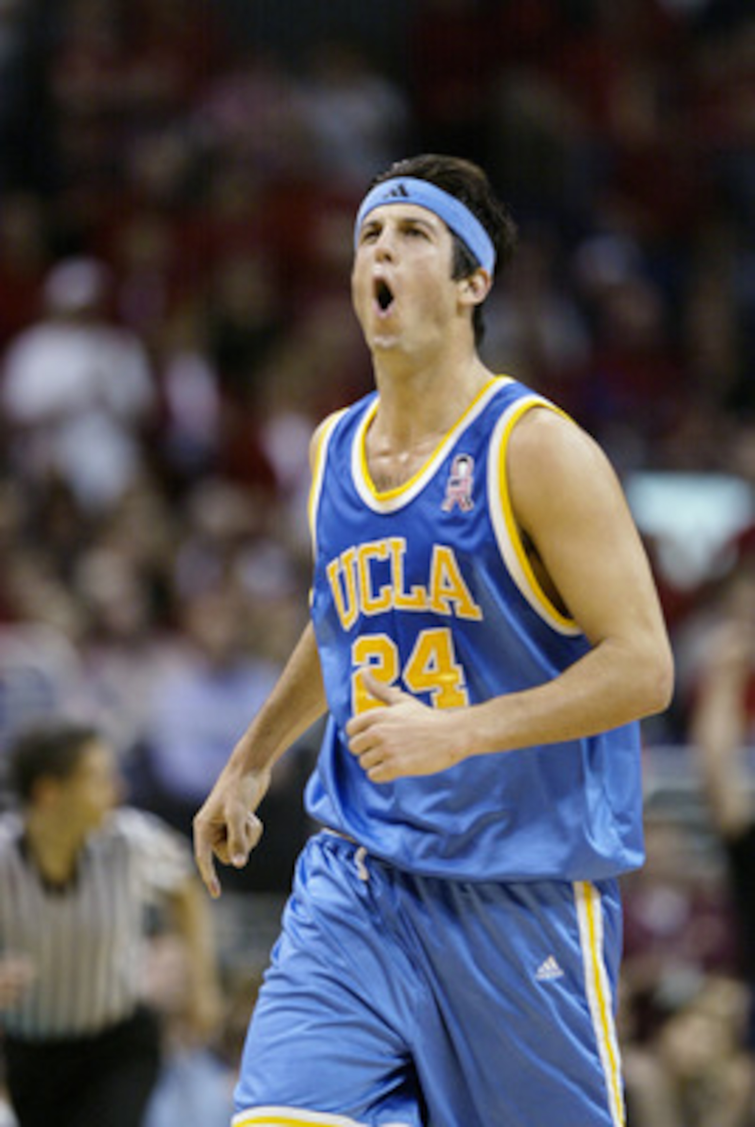 LOS ANGELES - MARCH 13: Jason Kapono #24 of UCLA vocally celebrates after the play against Arizona during the second half of the Pac-10 tournament game on March 13, 2003 at the Staples Center in Los Angeles, California. UCLA defeated #1 ranked Arizona i LOS ANGELES - MARCH 13: Jason Kapono #24 of UCLA vocally celebrates after the play against Arizona during the second half of the Pac-10 tournament game on March 13, 2003 at the Staples Center in Los Angeles, California. UCLA defeated #1 ranked Arizona i