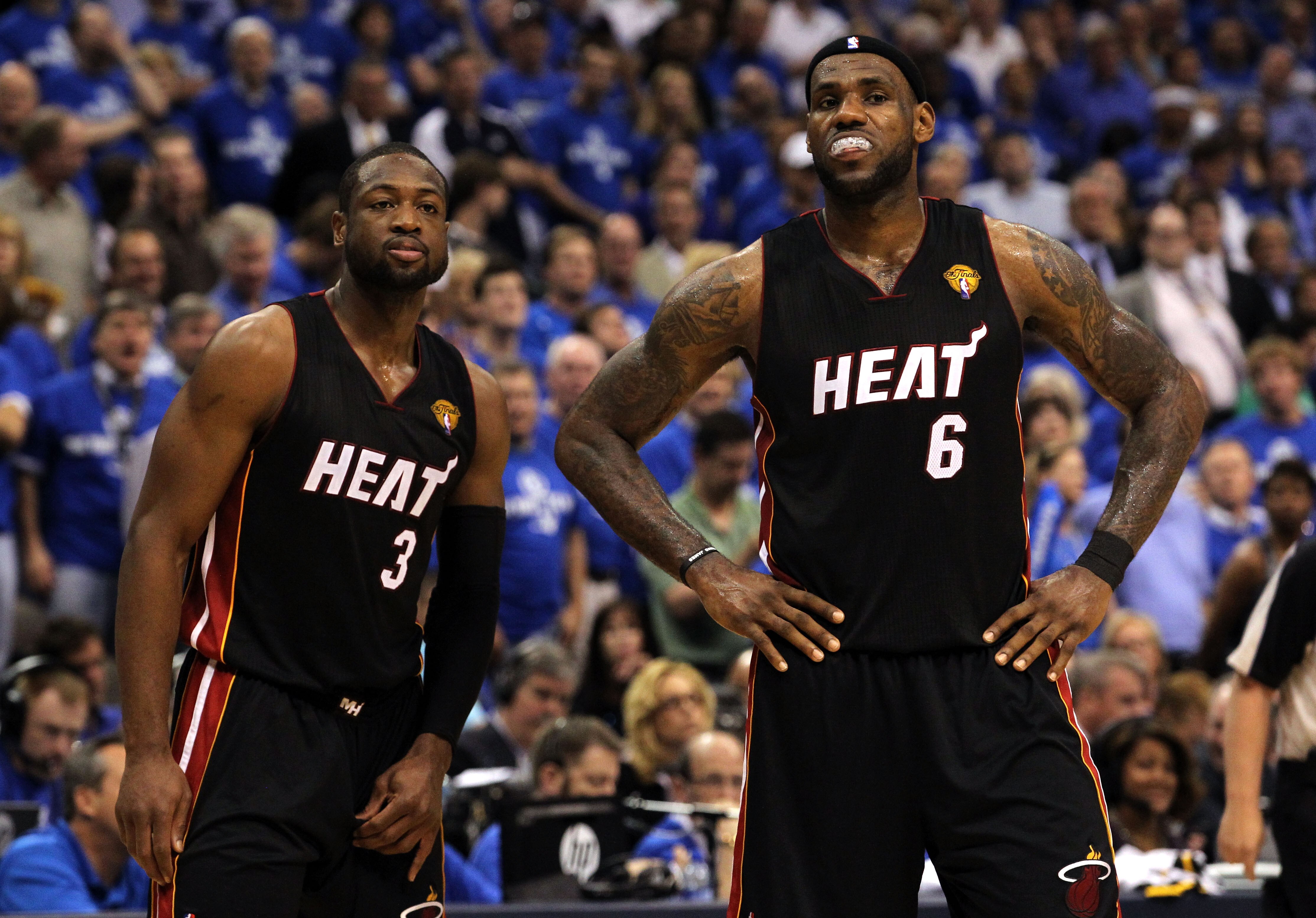 DALLAS, TX - JUNE 09: (L-R) Dwyane Wade #3 and LeBron James #6 of the Miami Heat look on against the Dallas Mavericks  in Game Five of the 2011 NBA Finals at American Airlines Center on June 9, 2011 in Dallas, Texas.  NOTE TO USER: User expressly acknowle
