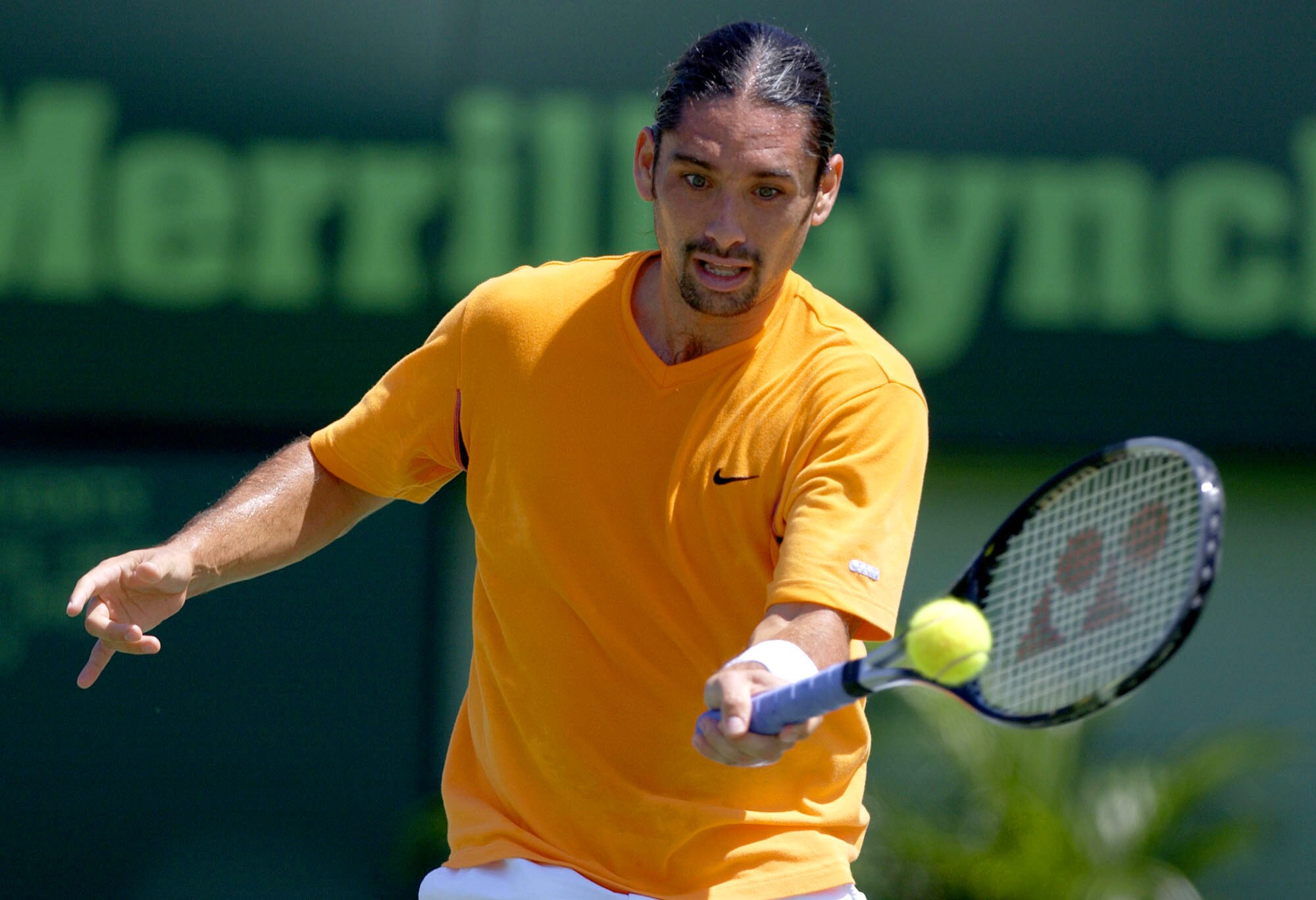 29 Mar 2002:   Marcelo Rios of Chile returns a shot to Andre Agassi during the Nasdaq-100 Open at The Tennis Center at Crandon Park in Miami, Florida. DIGITAL IMAGE Mandatory Credit: Ezra Shaw/Getty Images