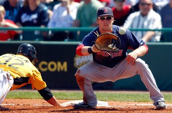 BRADENTON, FL - MARCH 13:  Infielder Lars Anderson #78 of the Boston Red Sox takes the throw at first as Brad Lincoln #32 of the Pittsburgh Pirates gets back safely during a Grapefruit League Spring Training Game at McKechnie Field on March 13, 2011 in Br