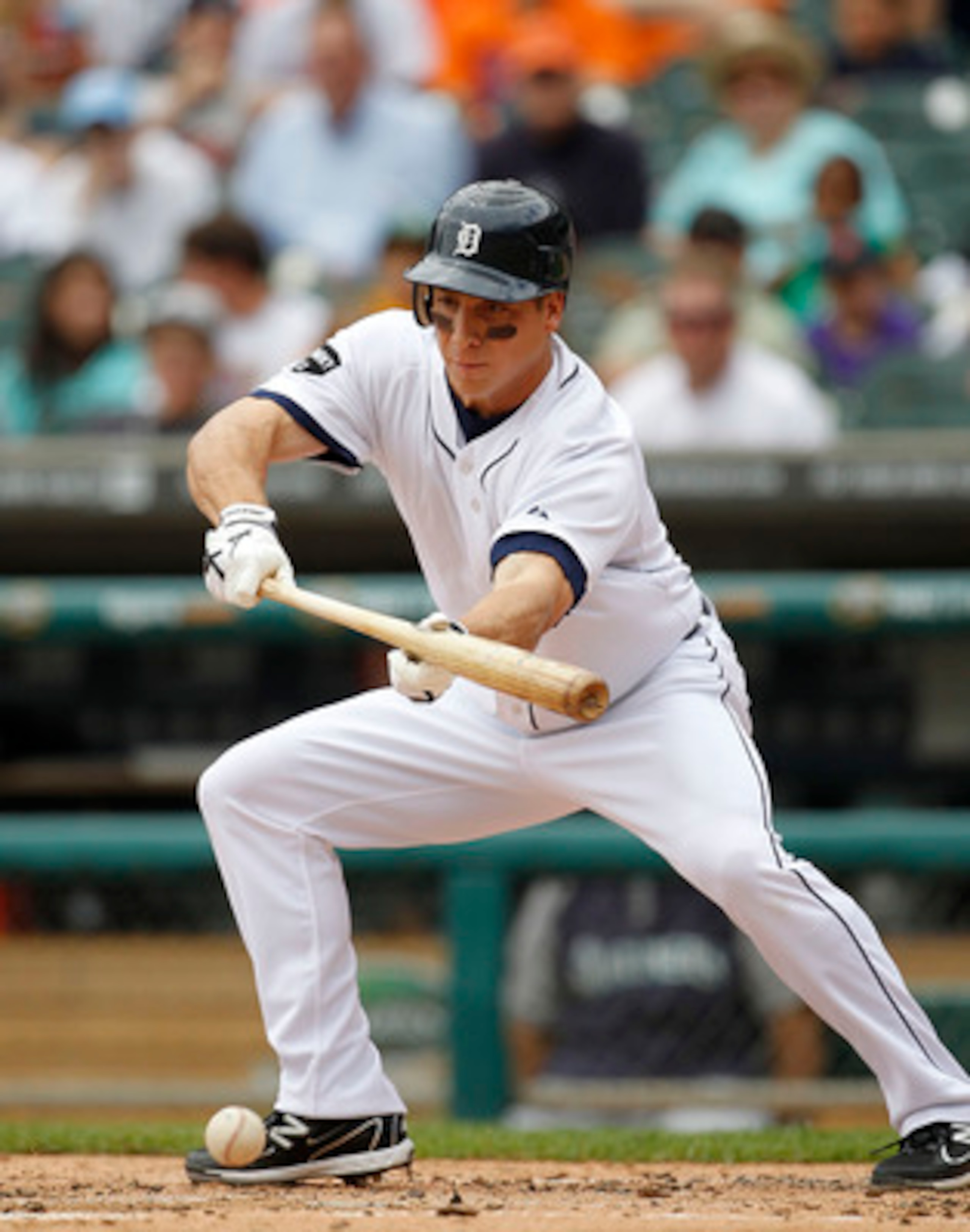 DETROIT - JUNE 12: Andy Dirks #12 of the Detroit Tigers bunts for a single in the second inning during the game against the Seattle Mariners at Comerica Park on June 12, 2011 in Detroit, Michigan. (Photo by Leon Halip/Getty Images) DETROIT - JUNE 12: Andy Dirks #12 of the Detroit Tigers bunts for a single in the second inning during the game against the Seattle Mariners at Comerica Park on June 12, 2011 in Detroit, Michigan. (Photo by Leon Halip/Getty Images)