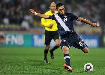 RUSTENBURG, SOUTH AFRICA - JUNE 12:  Clint Dempsey of the United States shoots and scores during the 2010 FIFA World Cup South Africa Group C match between England and USA at the Royal Bafokeng Stadium on June 12, 2010 in Rustenburg, South Africa.  (Photo