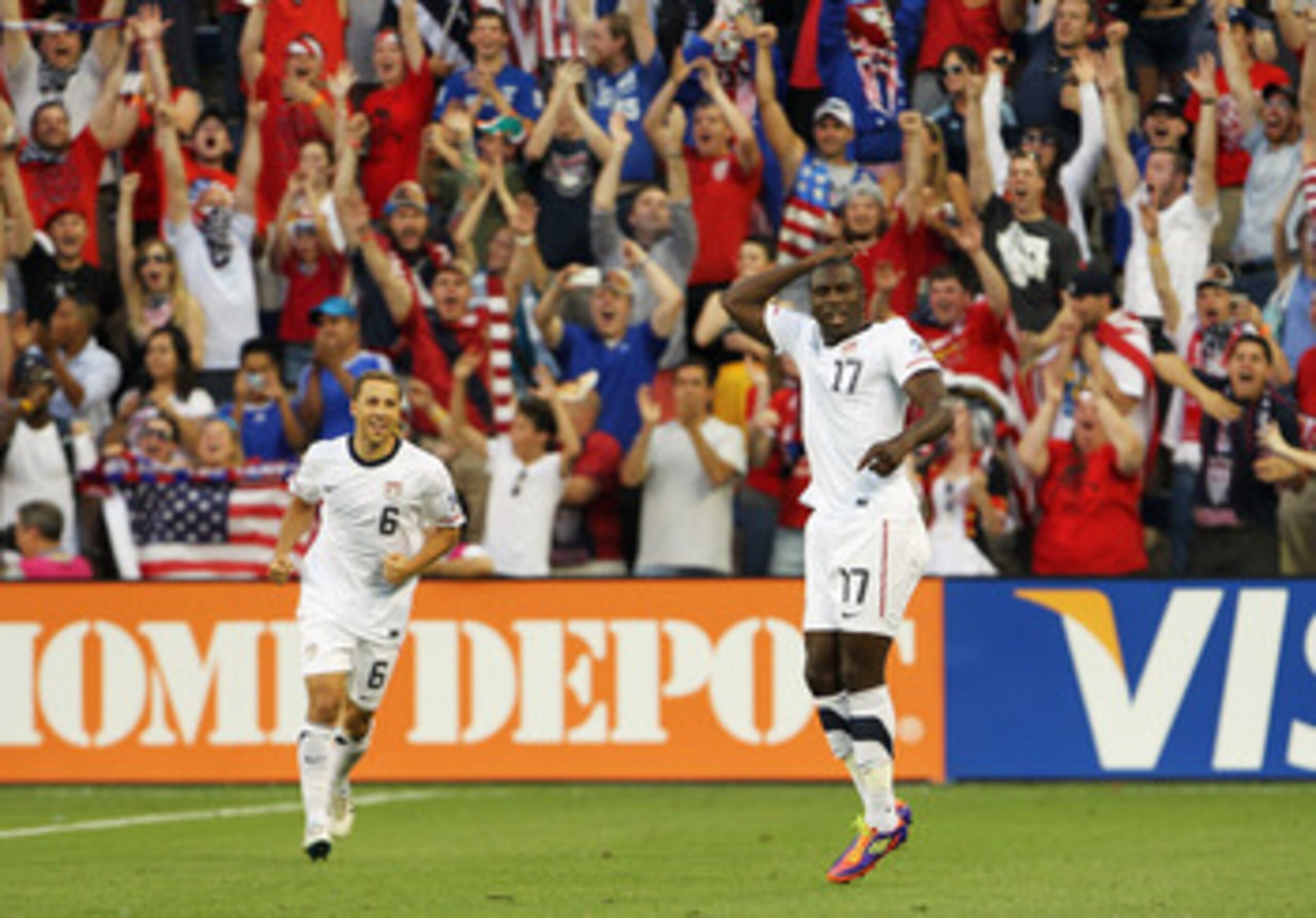 KANSAS CITY, MO - JUNE 14:  Jozy Altidore #17 of the USA celebrates alongside Steve Cherundolo #6 after scoring a goal during the first half of the GoldCup game against Guadeloupe on June 14, 2011 at LiveStrong Sporting Park in Kansas City, Kansas.  (Phot