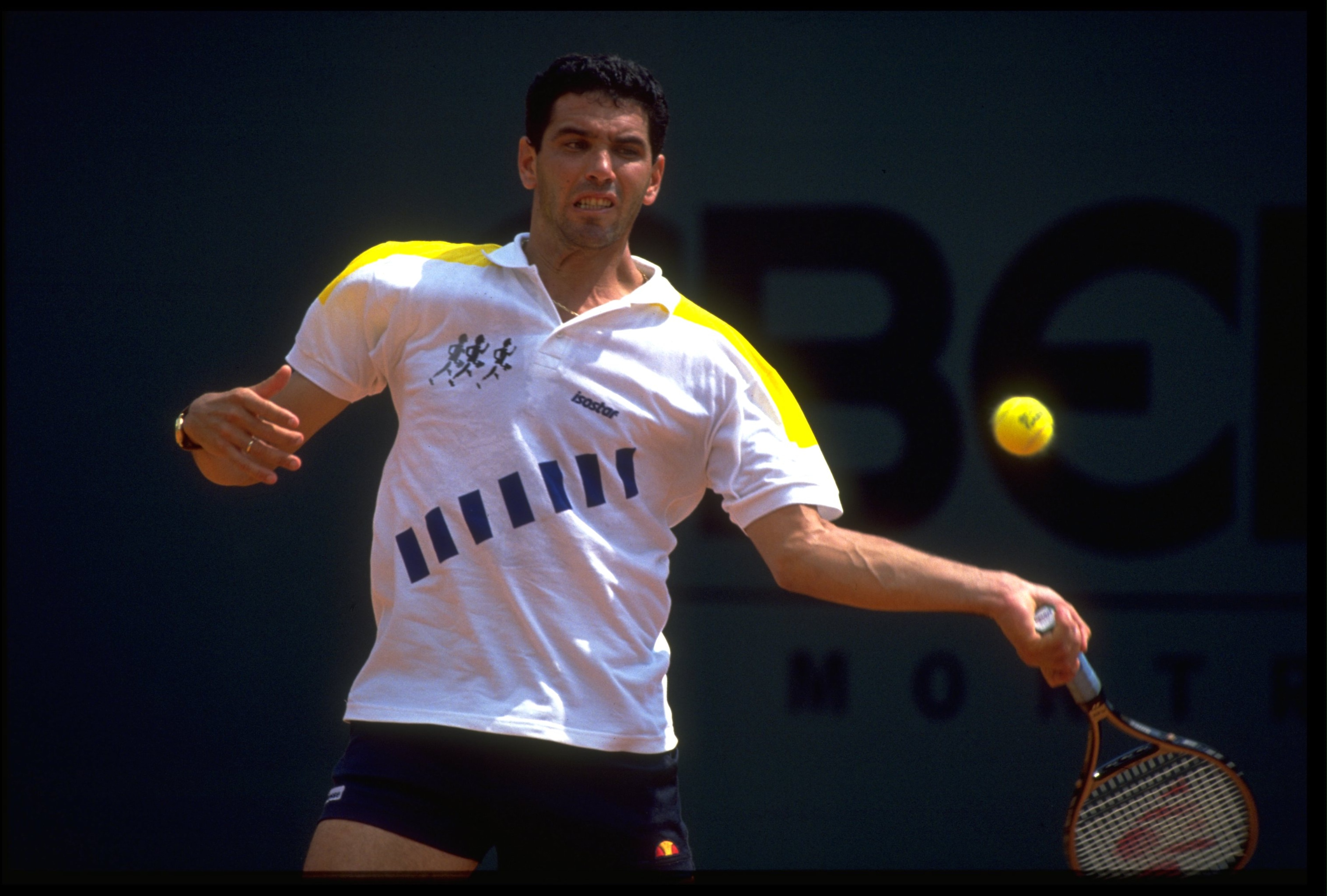 APR 1990: ANDRES GOMEZ OF ECUADOR PLAYS A BACKHAND STROKE DURING A MATCH AT THE 1990 MONTE CARLO OPEN. APR 1990: ANDRES GOMEZ OF ECUADOR PLAYS A BACKHAND STROKE DURING A MATCH AT THE 1990 MONTE CARLO OPEN.