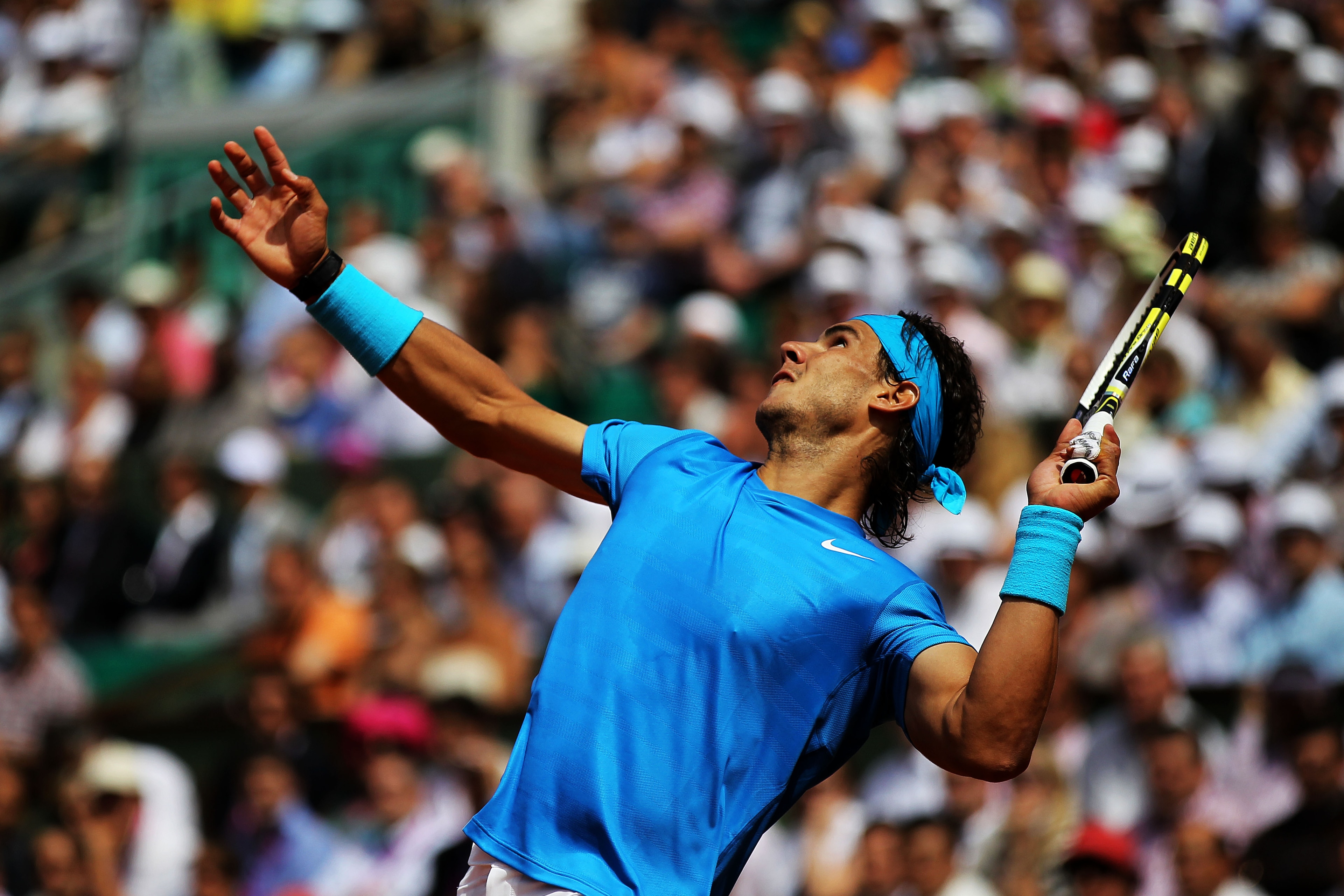 PARIS, FRANCE - MAY 24: Rafael Nadal of Spain serves during the men's singles round one match between Rafael Nadal of Spain and John Isner of USA on day three of the French Open at Roland Garros on May 24, 2011 in Paris, France. (Photo by Matthew Stockm PARIS, FRANCE - MAY 24: Rafael Nadal of Spain serves during the men's singles round one match between Rafael Nadal of Spain and John Isner of USA on day three of the French Open at Roland Garros on May 24, 2011 in Paris, France. (Photo by Matthew Stockm