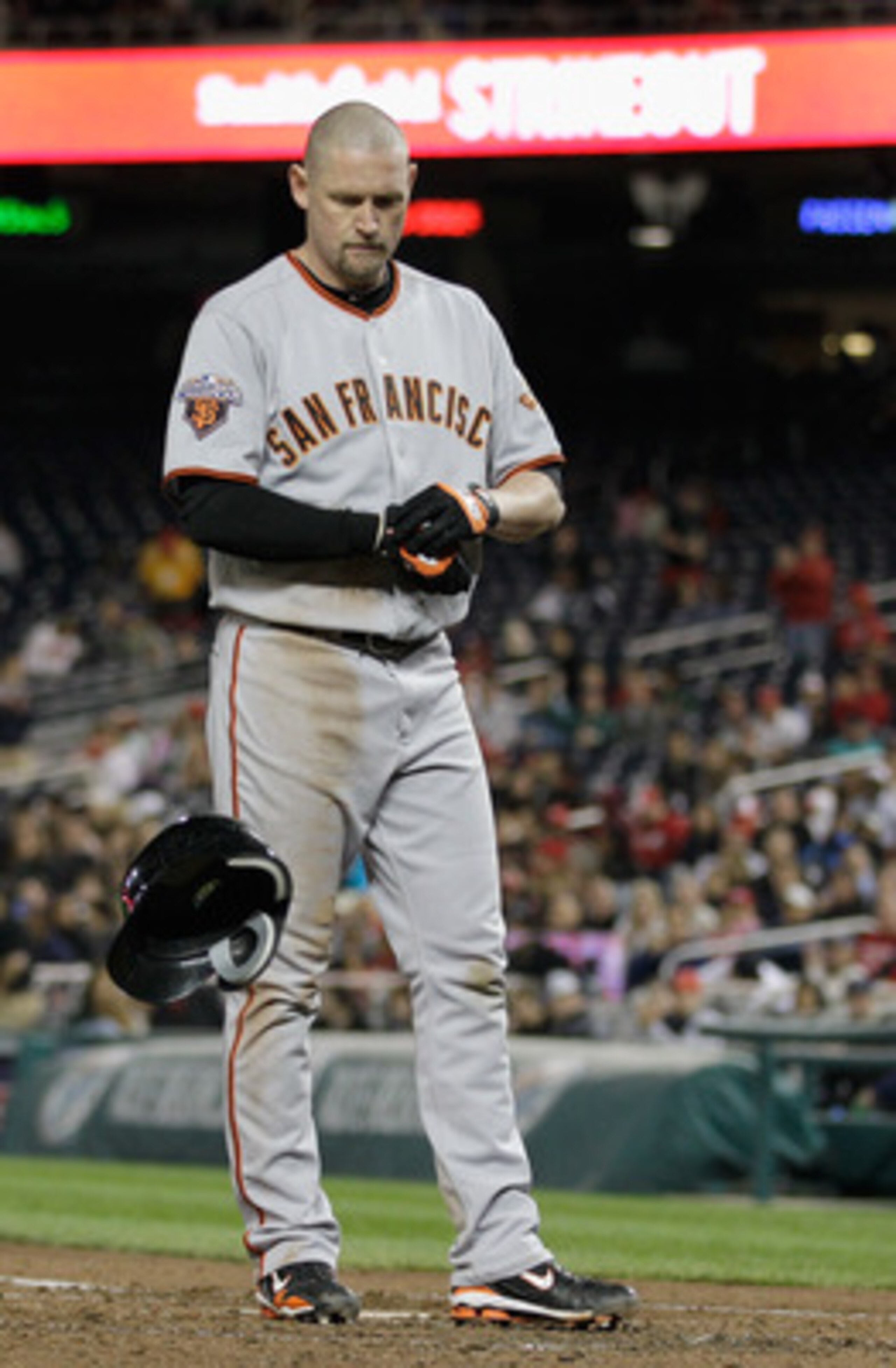 WASHINGTON, DC - APRIL 29:  Aubrey Huff #17 of the San Francisco Giants throws his helmet after striking out against the Washington Nationals to end the sixth inning at Nationals Park on April 29, 2011 in Washington, DC.  (Photo by Rob Carr/Getty Images)