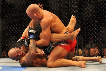 LAS VEGAS - JULY 11:  (Top) Georges St. Pierre battles Thiago Alves during their welterweight title bout during UFC 100 on July 11, 2009 in Las Vegas, Nevada.  (Photo by Jon Kopaloff/Getty Images)