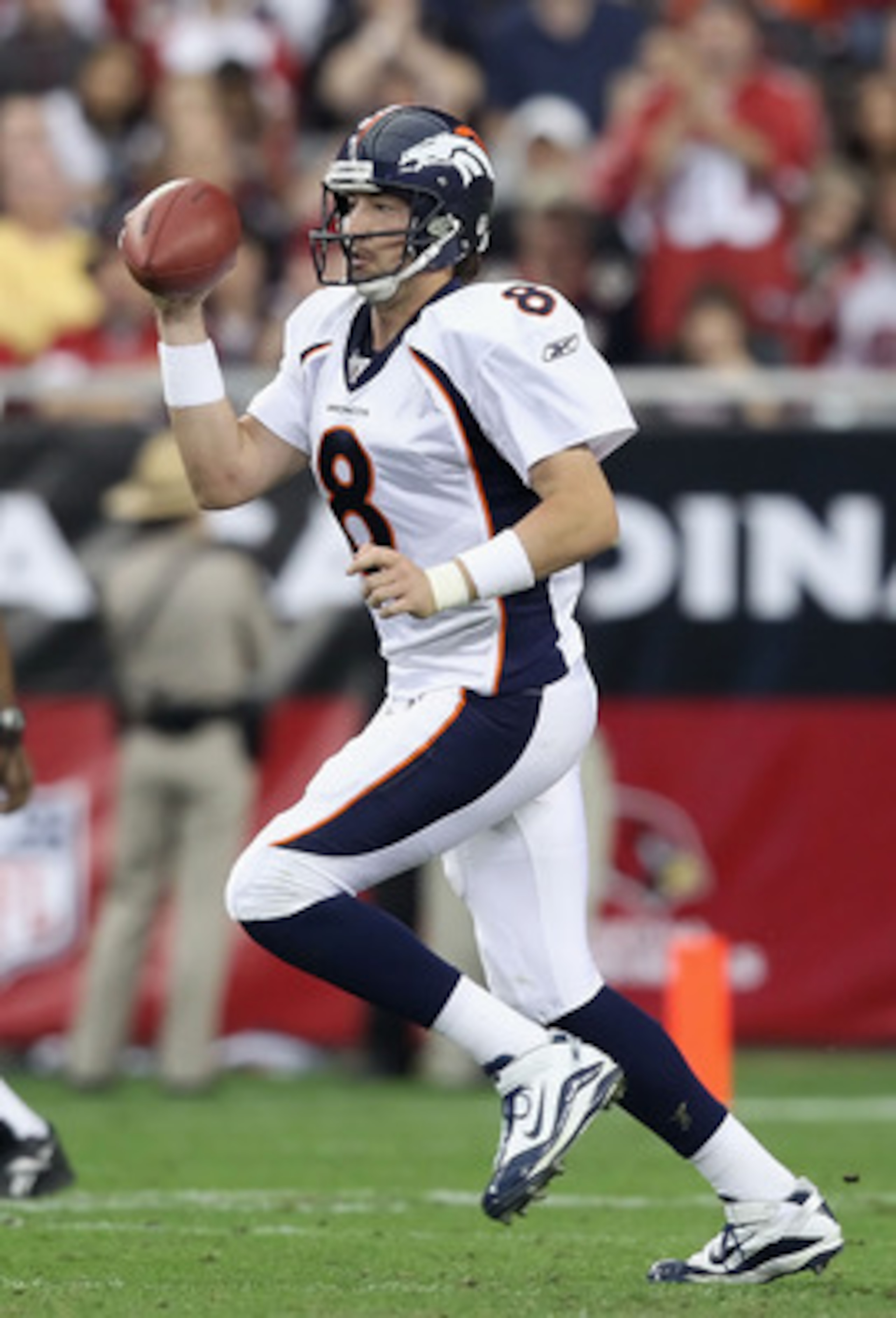 GLENDALE, AZ - DECEMBER 12:  Quarterback Kyle Orton #8 of the Denver Broncos drops back to pass during the NFL game against the Arizona Cardinals at the University of Phoenix Stadium on December 12, 2010 in Glendale, Arizona.  The Cardinals defeated the B