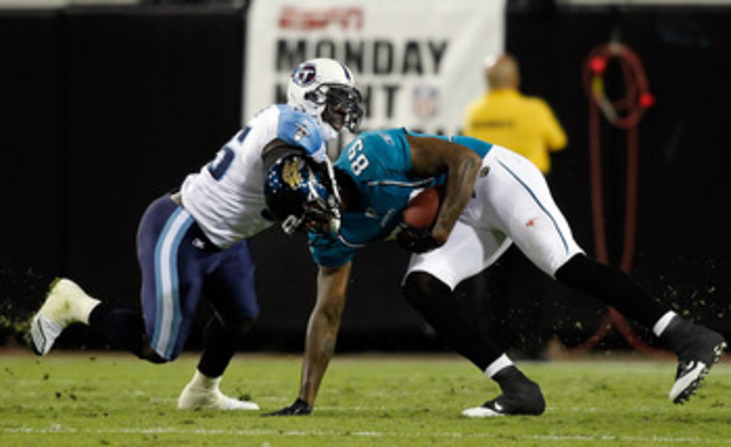 JACKSONVILLE, FL - OCTOBER 18: Receiver Marcedes Lewis #89 of the Jacksonville Jaguars is tackled by linebacker Stephen Tulloch #55 of the Tennessee Titans during the game at EverBank Field on October 18, 2010 in Jacksonville, Florida. (Photo by J. Meri JACKSONVILLE, FL - OCTOBER 18: Receiver Marcedes Lewis #89 of the Jacksonville Jaguars is tackled by linebacker Stephen Tulloch #55 of the Tennessee Titans during the game at EverBank Field on October 18, 2010 in Jacksonville, Florida. (Photo by J. Meri