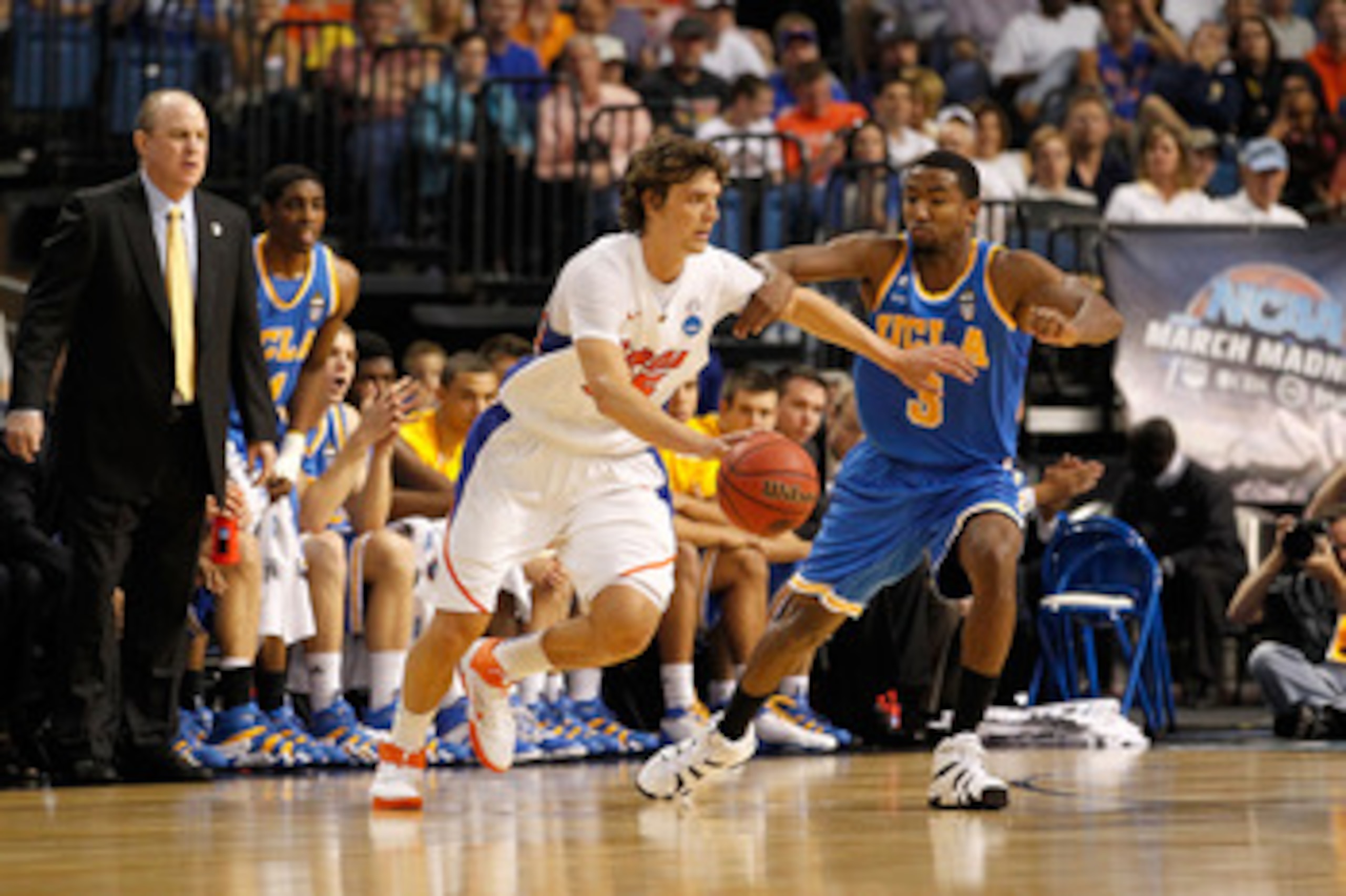 TAMPA, FL - MARCH 19:  Chandler Parsons #25 of the Florida Gators drives against Malcolm Lee #3 of the UCLA Bruins during the third round of the 2011 NCAA men's basketball tournament at St. Pete Times Forum on March 19, 2011 in Tampa, Florida.  (Photo by