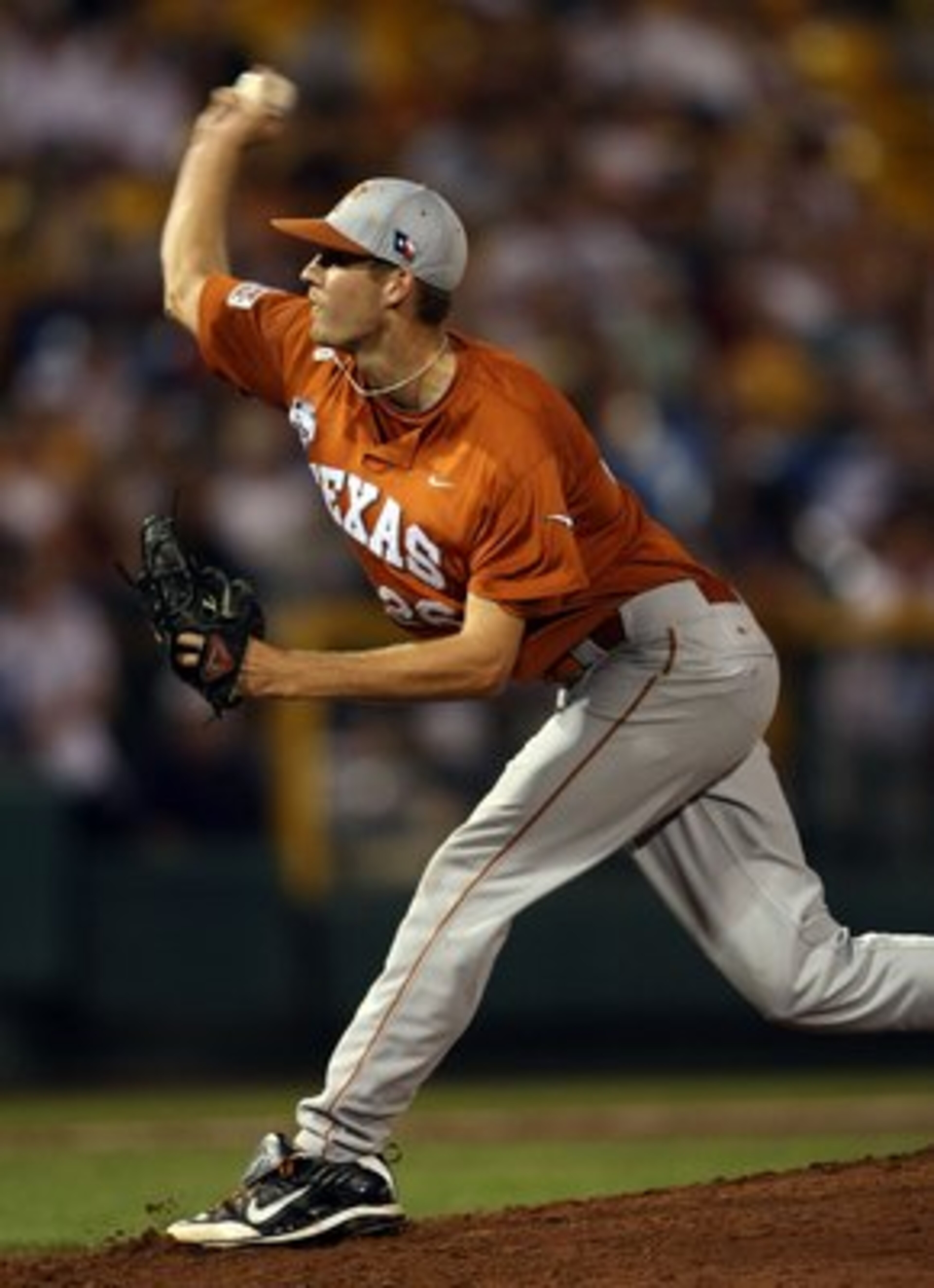 OMAHA, NE - JUNE 23: Taylor Jungmann #26 of the Texas Longhorns delivers a pitch against the Louisiana State University Tigers during Game 2 of the 2009 NCAA College World Series at Rosenblatt Stadium on June 23, 2009 in Omaha, Nebraska. The Longhorns de OMAHA, NE - JUNE 23: Taylor Jungmann #26 of the Texas Longhorns delivers a pitch against the Louisiana State University Tigers during Game 2 of the 2009 NCAA College World Series at Rosenblatt Stadium on June 23, 2009 in Omaha, Nebraska. The Longhorns de