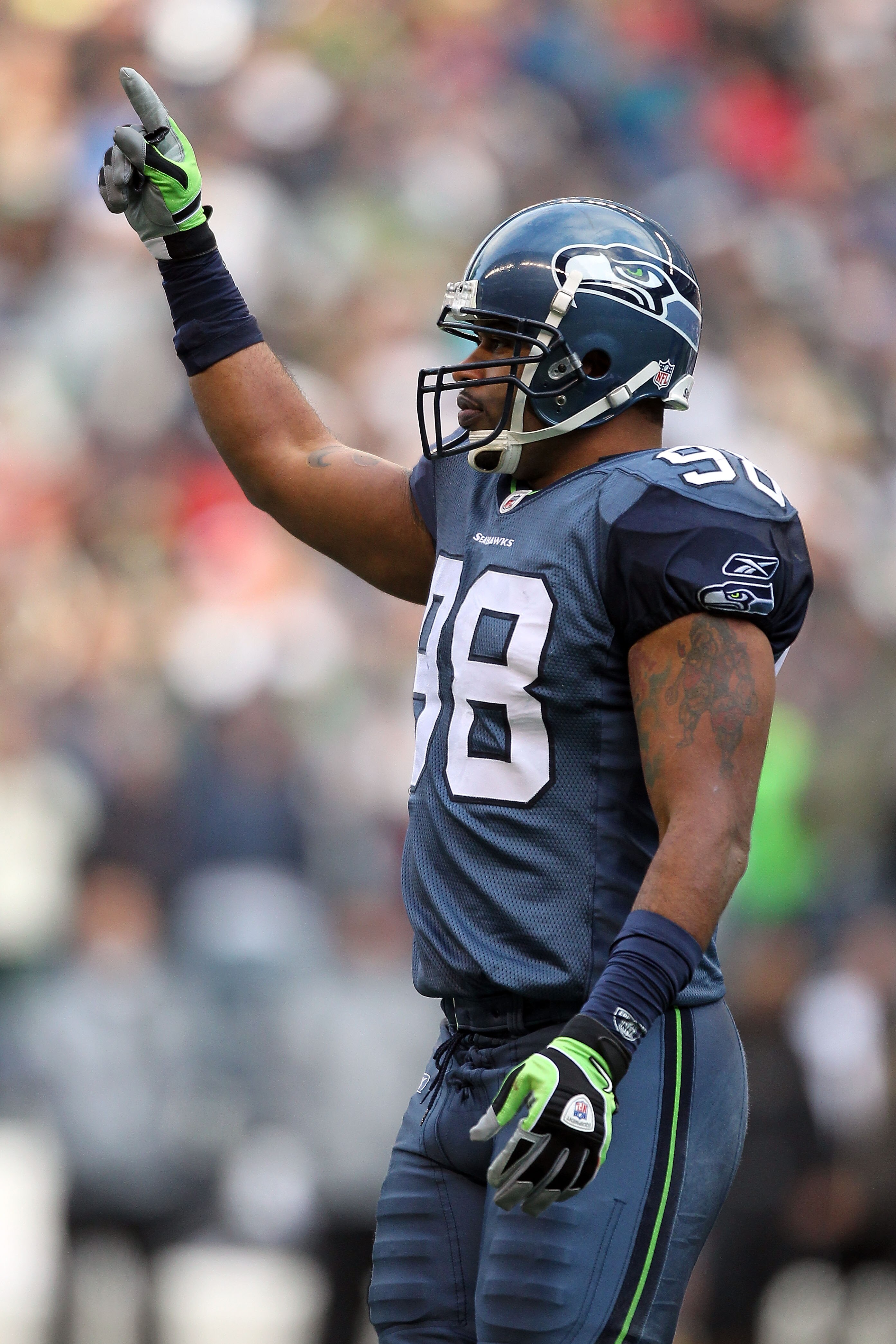 SEATTLE, WA - JANUARY 08:  Raheem Brock #98 of the Seattle Seahawks reacts after a defensive stop in the first half against the New Orleans Saints during the 2011 NFC wild-card playoff game at Qwest Field on January 8, 2011 in Seattle, Washington.  (Photo