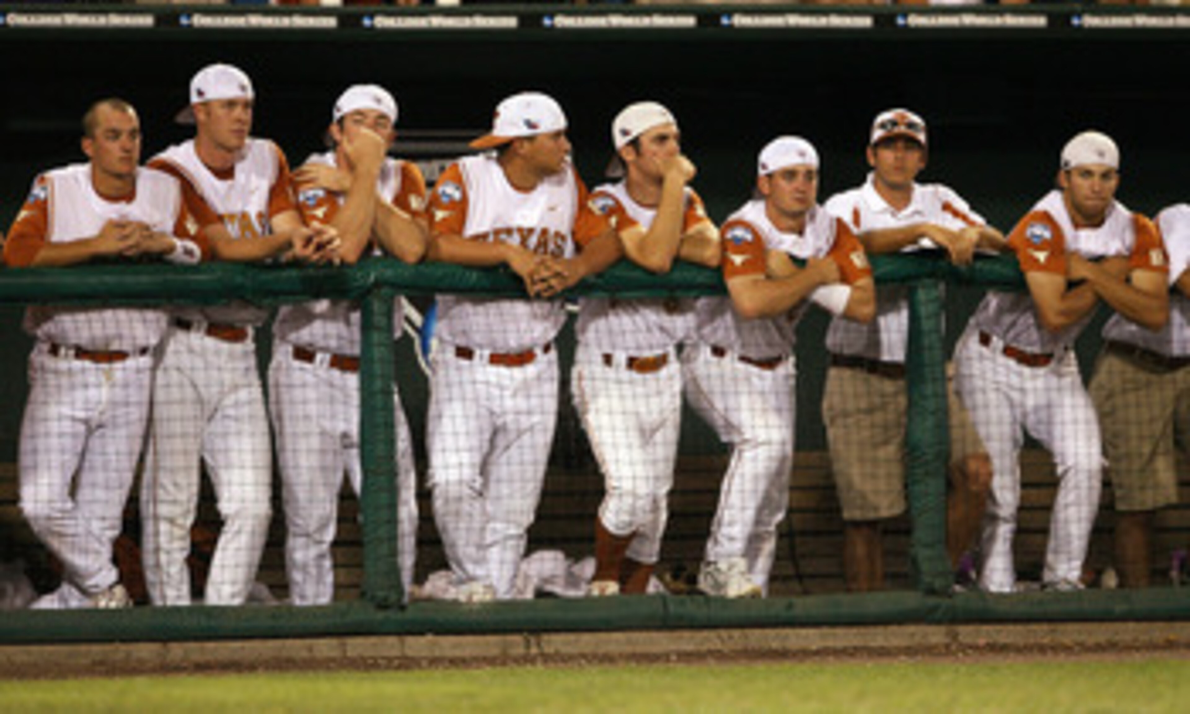 OMAHA, NE - JUNE 24: The Texas Longhorns watch as the Louisiana State University Tigers celebrate after Game 3 of the 2009 NCAA College World Series at Rosenblatt Stadium on June 24, 2009 in Omaha, Nebraska. The Tigers defeated the Longhorns 11-4 to win OMAHA, NE - JUNE 24: The Texas Longhorns watch as the Louisiana State University Tigers celebrate after Game 3 of the 2009 NCAA College World Series at Rosenblatt Stadium on June 24, 2009 in Omaha, Nebraska. The Tigers defeated the Longhorns 11-4 to win