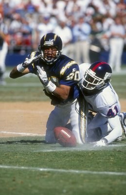 27 Sep 1998:  Wide Receiver Bryan Still #80 of the San Diego Chargers is tackled by Conrad Hamilton #41 of the New York Giants during a game at the Qualcomm Stadium in San Diego, California. The Giants defeated the Chargers 34-16.