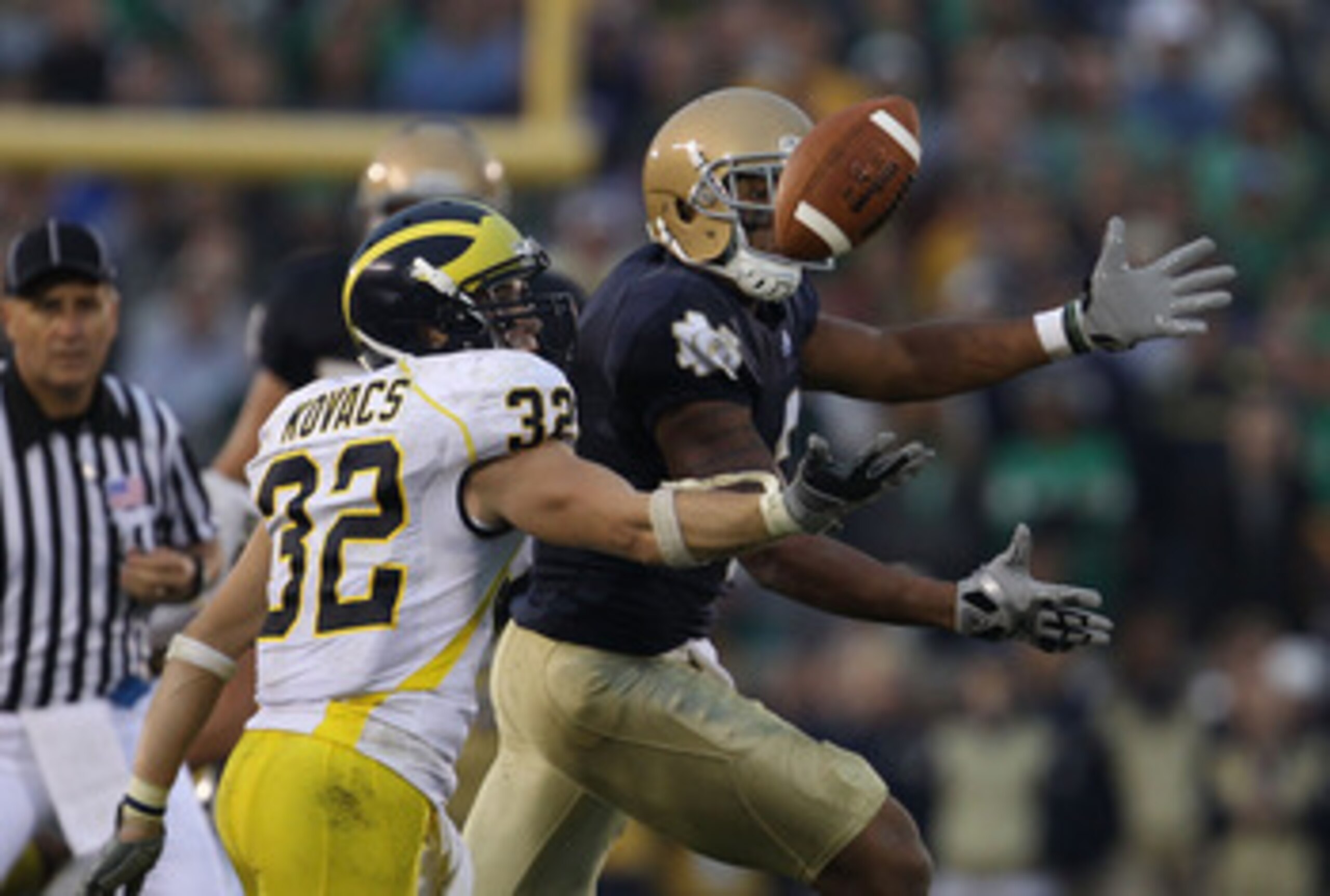SOUTH BEND, IN - SEPTEMBER 11: Jordan Kovacs #32 of the Michigan Wolverines breaks up a pass intended for Michael Floyd #3 of the Notre Dame Fighting Irish at Notre Dame Stadium on September 11, 2010 in South Bend, Indiana. Michigan defeated Notre Dame 28 SOUTH BEND, IN - SEPTEMBER 11: Jordan Kovacs #32 of the Michigan Wolverines breaks up a pass intended for Michael Floyd #3 of the Notre Dame Fighting Irish at Notre Dame Stadium on September 11, 2010 in South Bend, Indiana. Michigan defeated Notre Dame 28