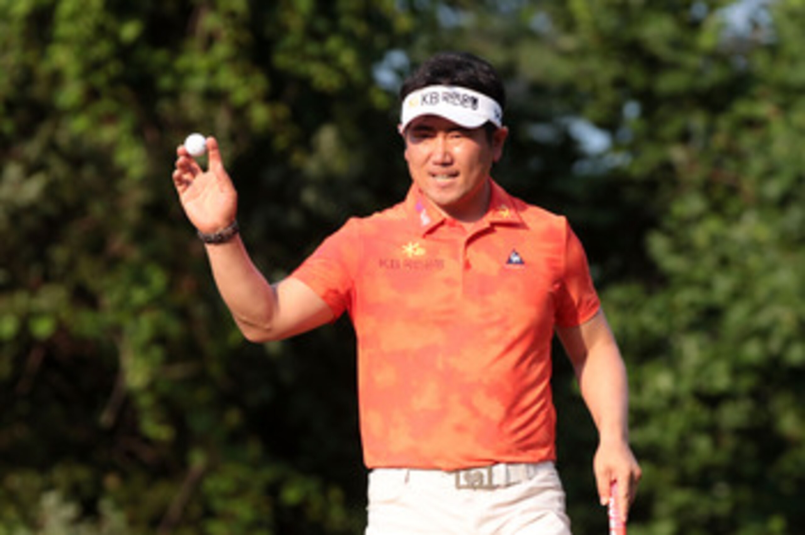 BETHESDA, MD - JUNE 17:  Y.E. Yang of South Korea waves to fans on the 16th green during the second round of the 111th U.S. Open at Congressional Country Club on June 17, 2011 in Bethesda, Maryland.  (Photo by Ross Kinnaird/Getty Images)
