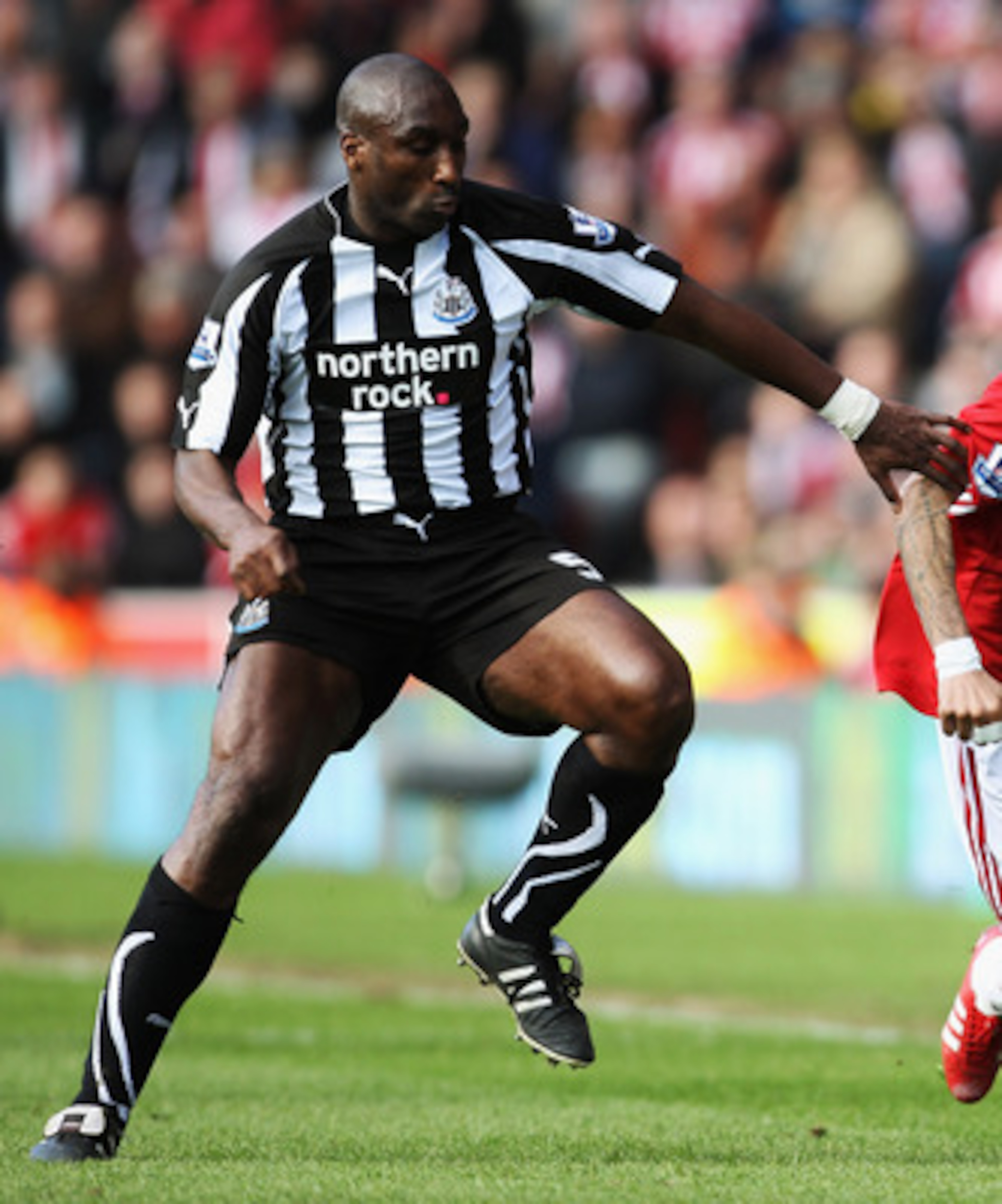 STOKE ON TRENT, ENGLAND - MARCH 19:  Jermaine Pennant of Stoke City battles with Sol Campbell of Newcastle United during the Barclays Premier League match between Stoke City and Newcastle United at Britannia Stadium on March 19, 2011 in Stoke on Trent, En