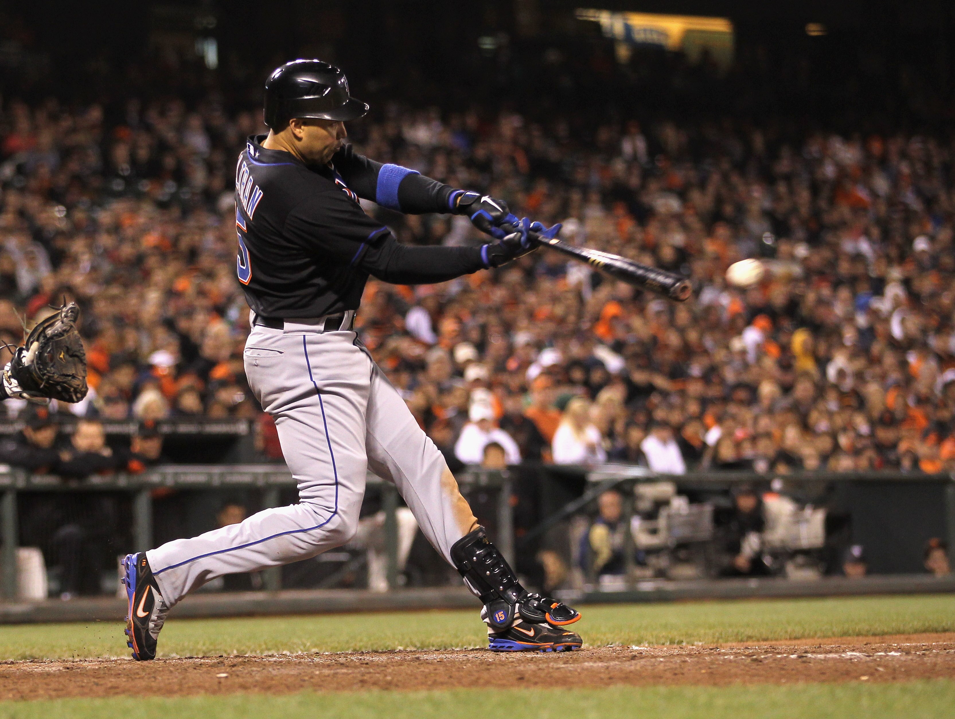 SAN FRANCISCO, CA - JULY 08:  Carlos Beltran #15 of the New York Mets hits a single that scored Angel Pagan #16 of the New York Mets in the ninth inning against the San Francisco Giants at AT&T Park on July 8, 2011 in San Francisco, California.  (Photo by