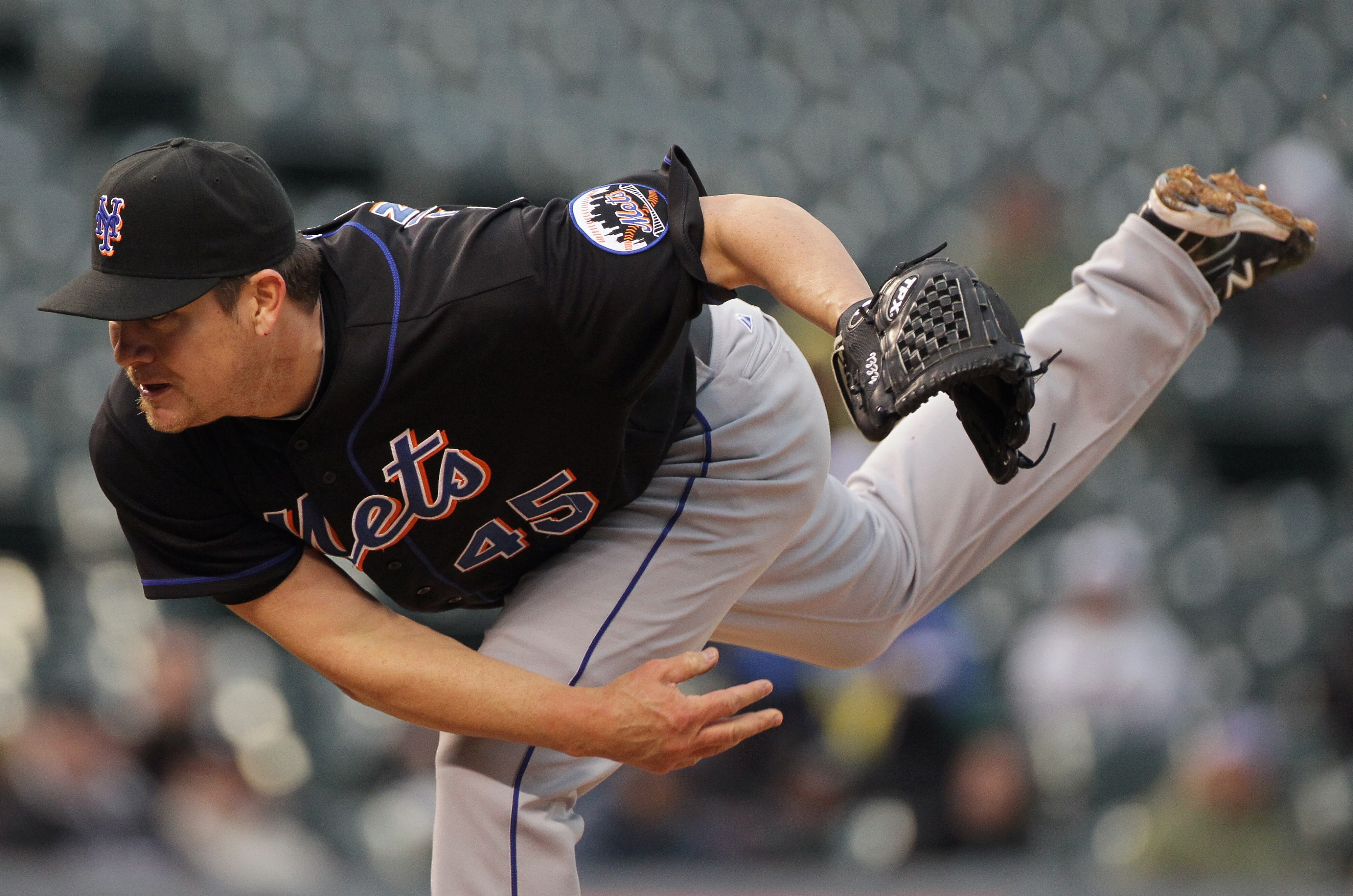 DENVER, CO - MAY 12:  Pitcher Jason Isringhausen #45 of the New York Mets delivers against the Colorado Rockies at Coors Field on May 12, 2011 in Denver, Colorado.  (Photo by Doug Pensinger/Getty Images)