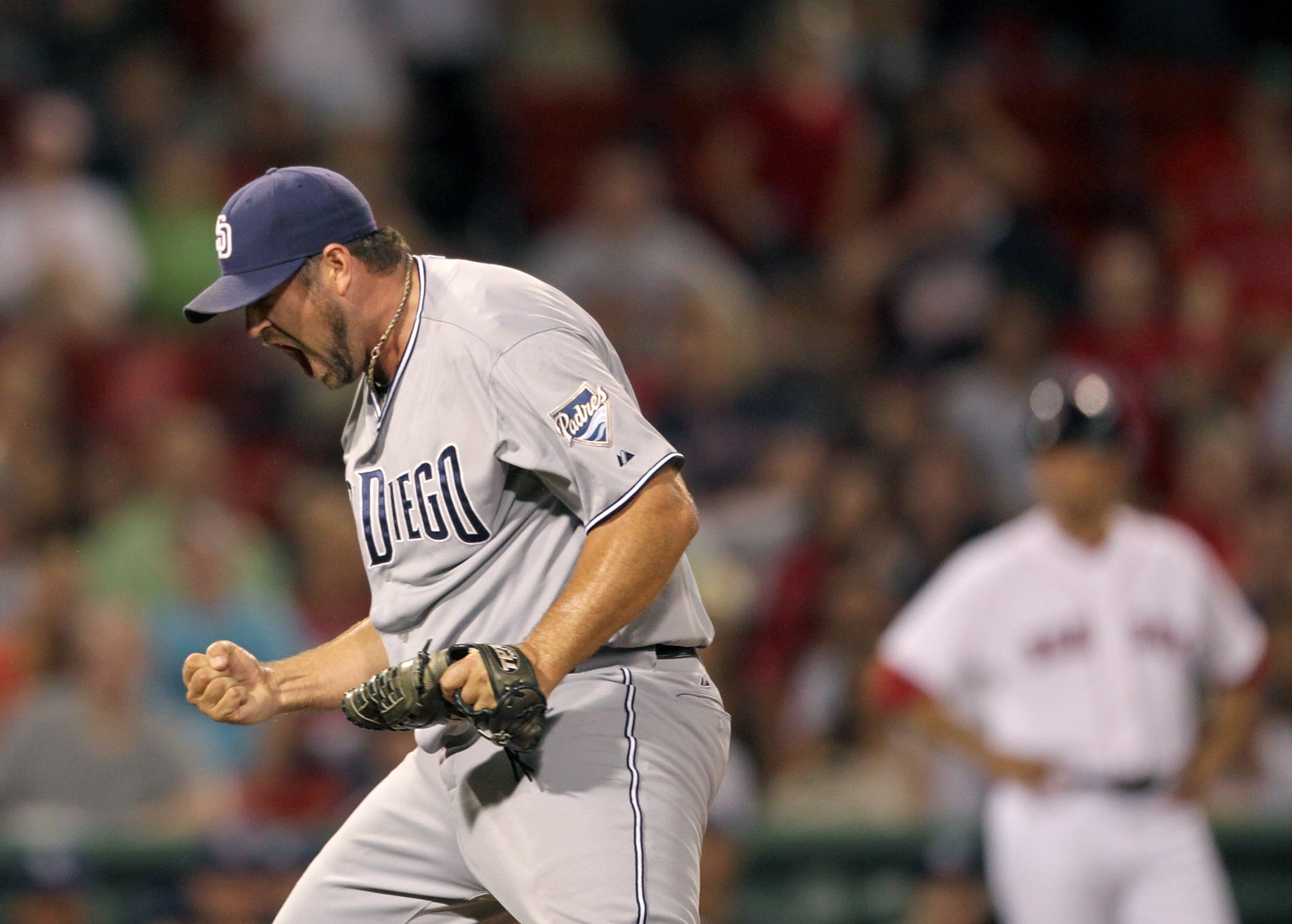 BOSTON, MA  - JUNE 21:  Heath Bell #21 of the San Diego Padres reacts in the ninth inning after a 5-4 win against the Boston Red Sox at Fenway Park on June 21, 2011 in Boston, Massachusetts.  (Photo by Jim Rogash/Getty Images)