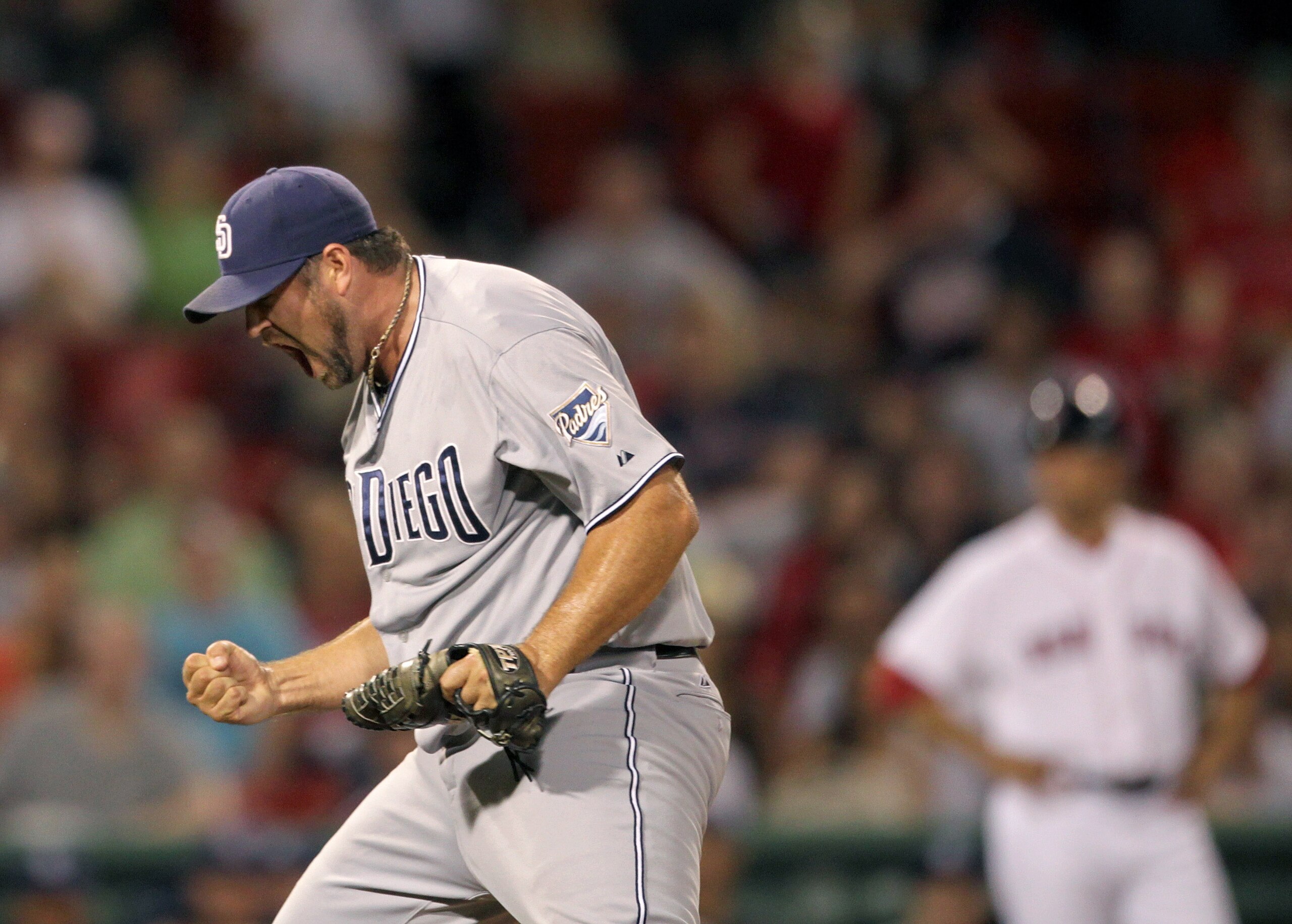 BOSTON, MA  - JUNE 21:  Heath Bell #21 of the San Diego Padres reacts in the ninth inning after a 5-4 win against the Boston Red Sox at Fenway Park on June 21, 2011 in Boston, Massachusetts.  (Photo by Jim Rogash/Getty Images)