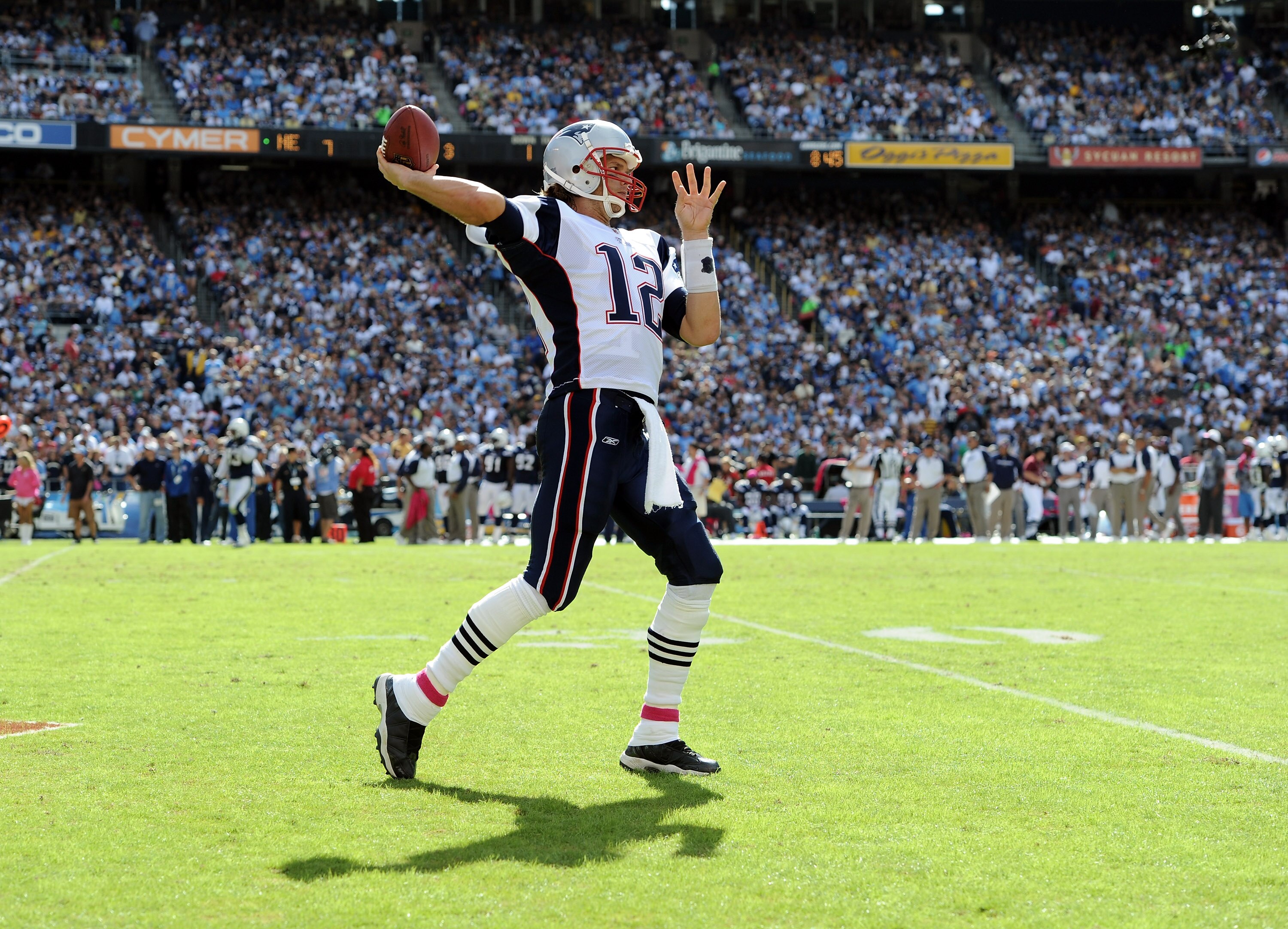 SAN DIEGO - OCTOBER 24:  Tom Brady #12 of the  New England Patriots throws passes during a delay against the San Diego Chargers at Qualcomm Stadium on October 24, 2010 in San Diego, California.  (Photo by Harry How/Getty Images)