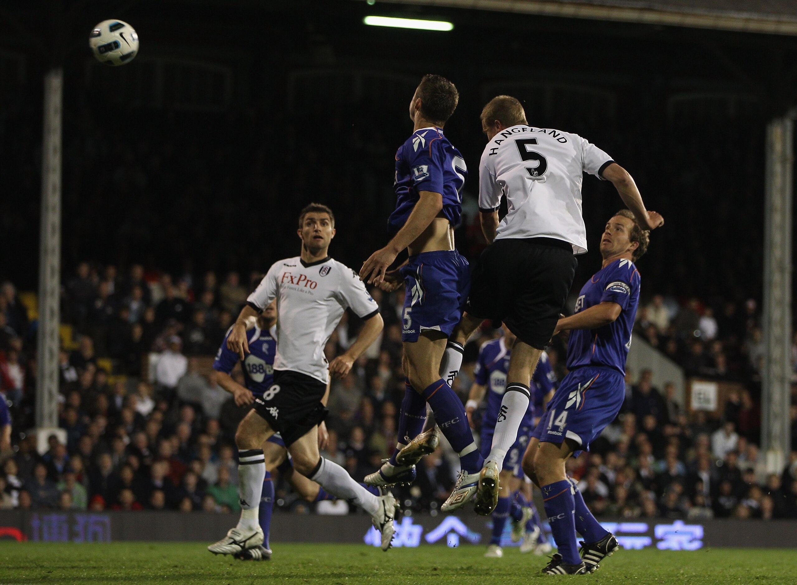 LONDON, ENGLAND - APRIL 27:  Brede Hangeland (#5) of Fulham rises above Gary Cahill (L) to score his sides third goal during the Barclays Premier League match between Fulham and Bolton Wanderers at Craven Cottage on April 27, 2011 in London, England.  (Ph