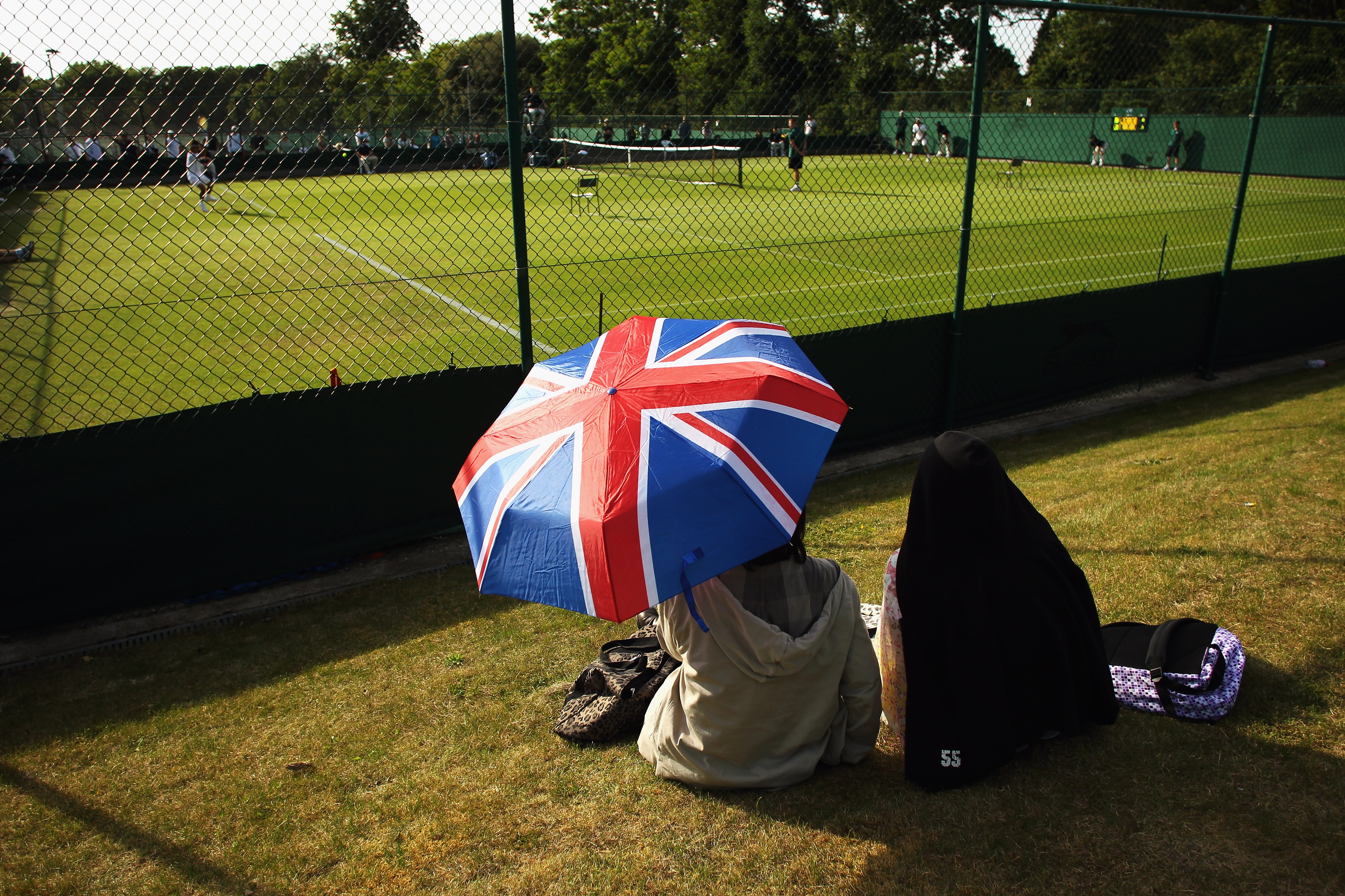 LONDON, ENGLAND - JUNE 14:  Spectators enjoy day two of the Wimbledon Championships 2011 Qualifying at the Bank of England Sports Ground on June 14, 2011 in London, England.  (Photo by Bryn Lennon/Getty Images)