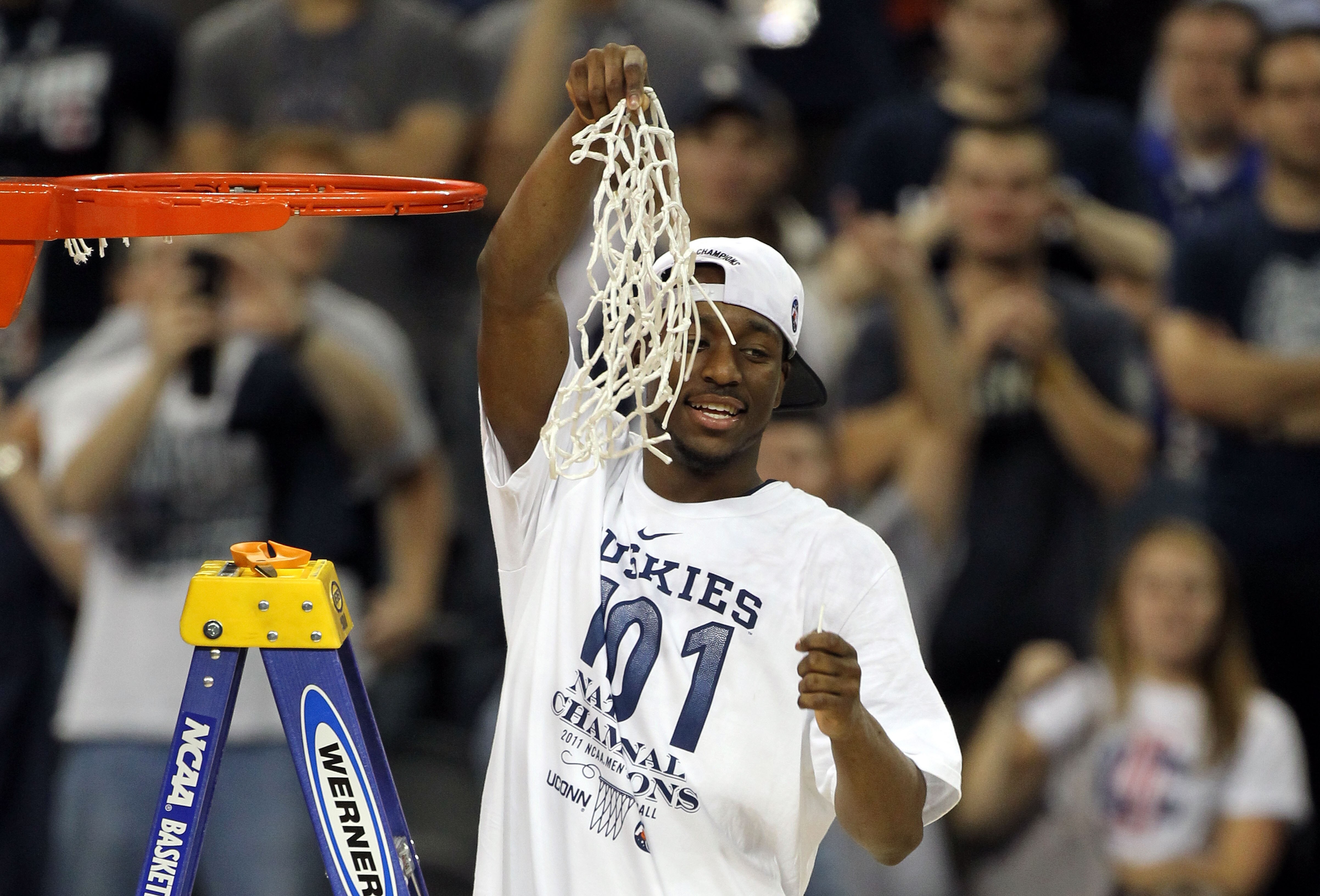 HOUSTON, TX - APRIL 04:  Kemba Walker #15 of the Connecticut Huskies cuts down the net after defeating the Butler Bulldogs to win the National Championship Game of the 2011 NCAA Division I Men's Basketball Tournament by a score of 53-41 at Reliant Stadium