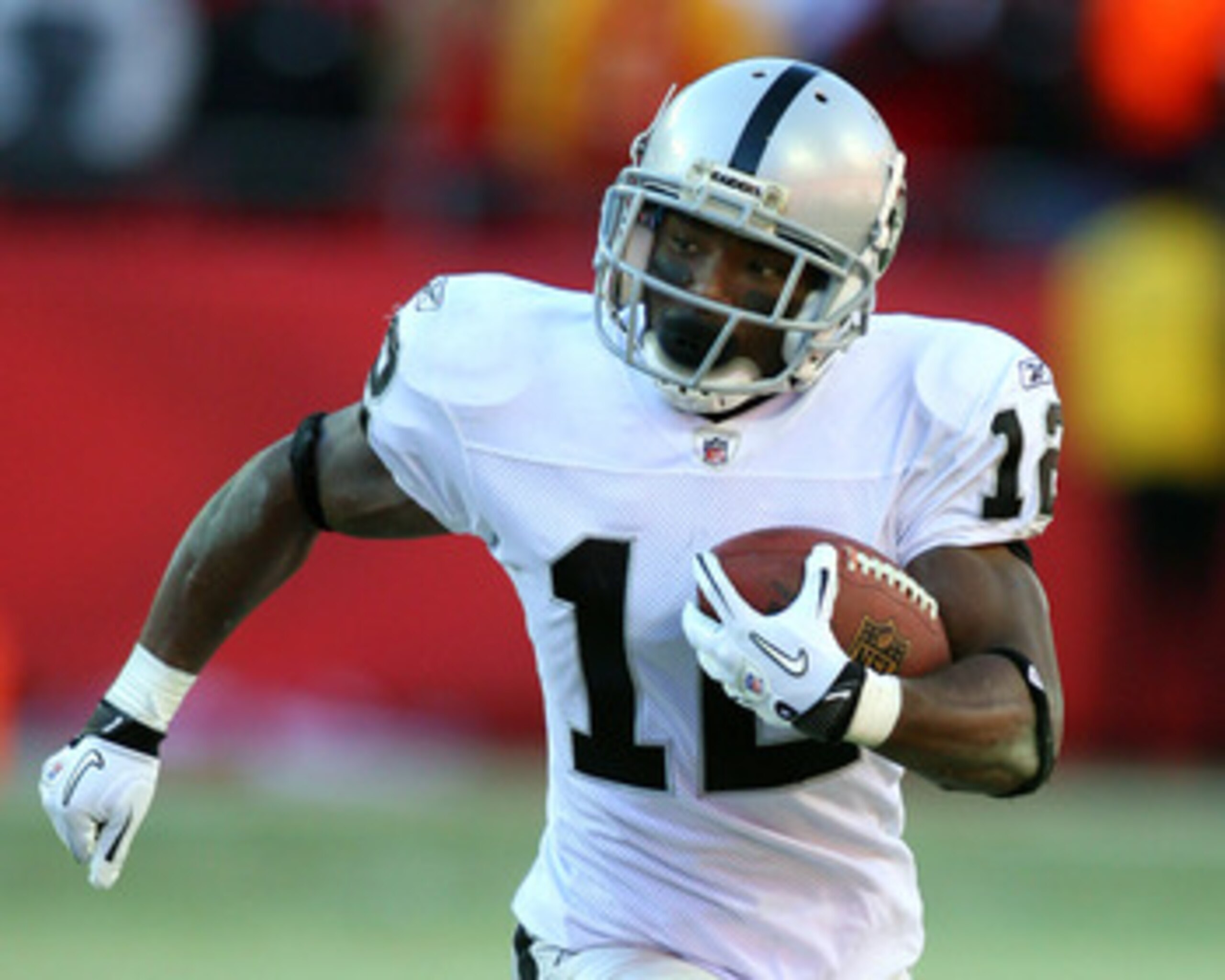 KANSAS CITY, MO - JANUARY 02:  Wide receiver Jacoby Ford #12 of the Oakland Raiders runs down field in a game against the Kansas City Chiefs at Arrowhead Stadium on January 2, 2011 in Kansas City, Missouri.  (Photo by Tim Umphrey/Getty Images)