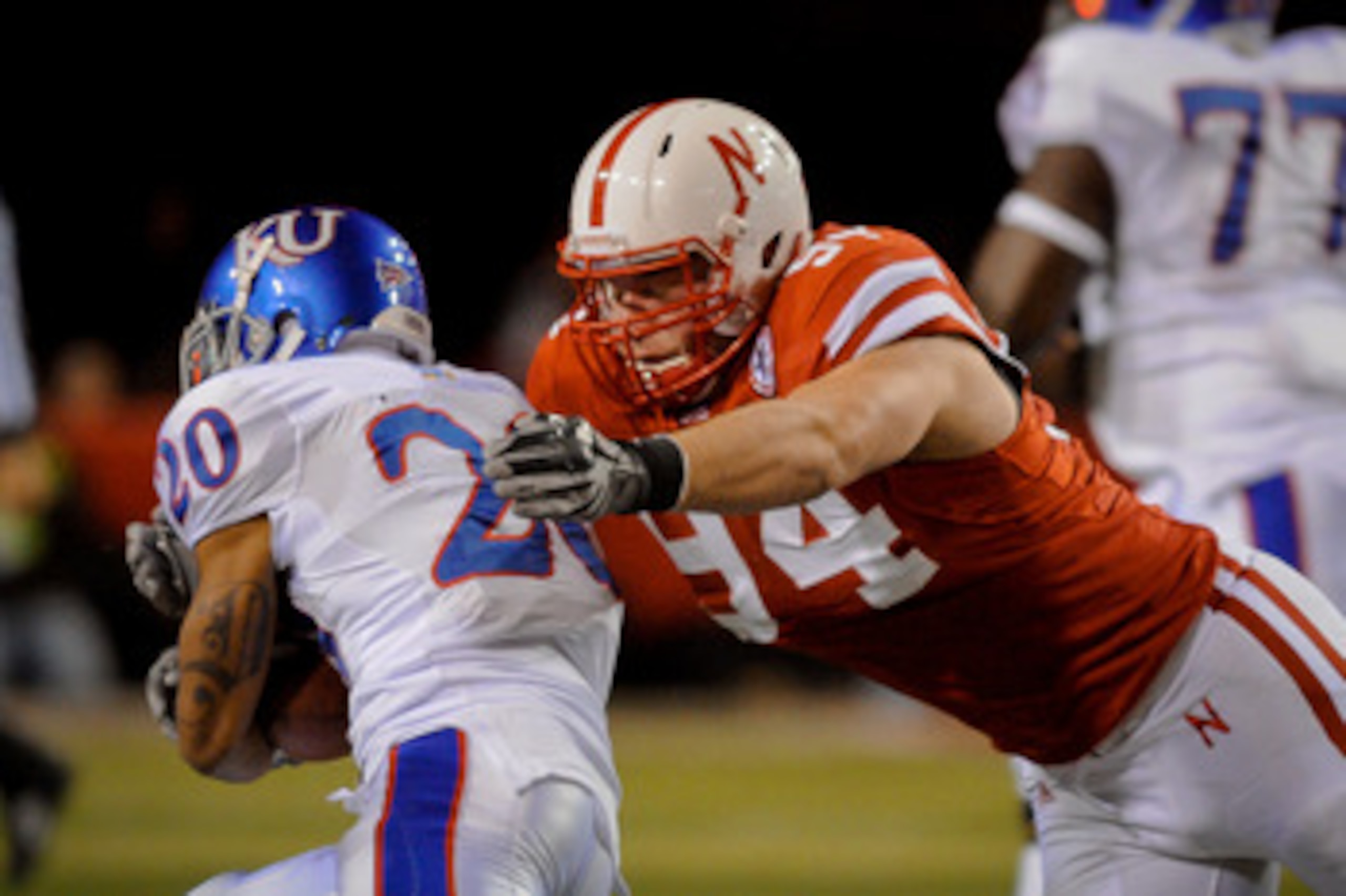 LINCOLN, NE - NOVEMBER 13: Jared Crick #94 of the Nebraska Cornhuskers runs down D.J. Beshears #20 of the Kansas Jayhawks during first half action of their game at Memorial Stadium on November 13, 2010 in Lincoln, Nebraska. (Photo by Eric Francis/Getty I LINCOLN, NE - NOVEMBER 13: Jared Crick #94 of the Nebraska Cornhuskers runs down D.J. Beshears #20 of the Kansas Jayhawks during first half action of their game at Memorial Stadium on November 13, 2010 in Lincoln, Nebraska. (Photo by Eric Francis/Getty I