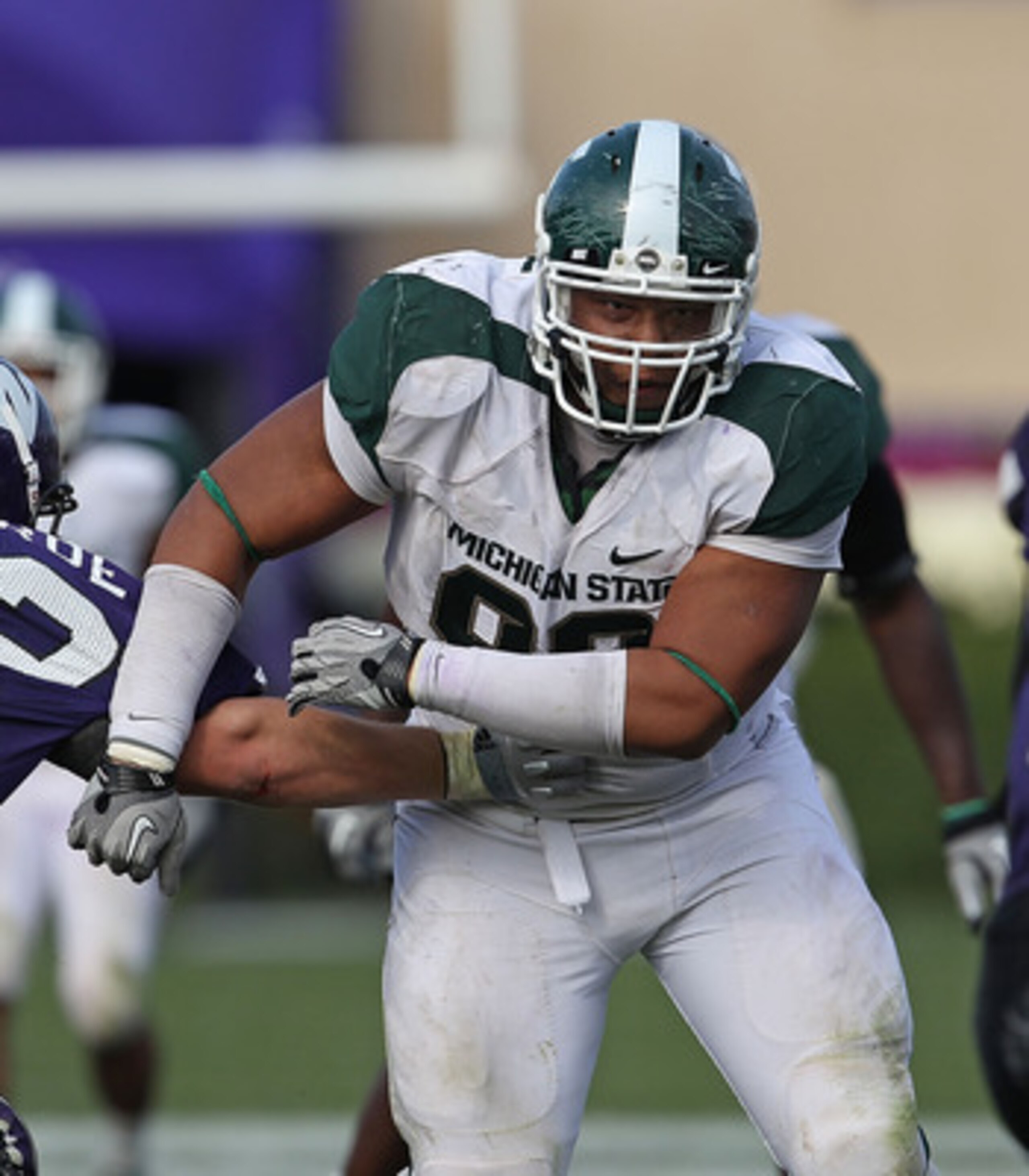 EVANSTON, IL - OCTOBER 23: Jerel Worthy #99 of the Michigan State Spartans moves past a block attempt by Brian Mulroe #72 of the Northwestern Wildcats with his sights set on Dan Persa #7 at Ryan Field on October 23, 2010 in Evanston, Illinois. Michigan St EVANSTON, IL - OCTOBER 23: Jerel Worthy #99 of the Michigan State Spartans moves past a block attempt by Brian Mulroe #72 of the Northwestern Wildcats with his sights set on Dan Persa #7 at Ryan Field on October 23, 2010 in Evanston, Illinois. Michigan St
