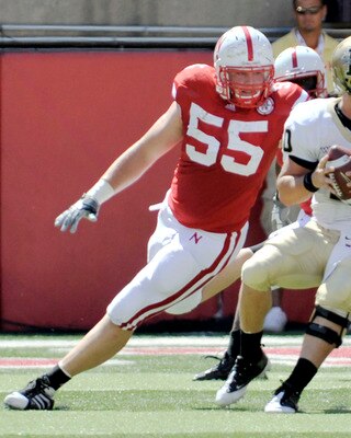 LINCOLN, NEBRASKA - SEPTEMBER 11: Idaho Vandals quarterback Nathan Enderle #10 tries to elude over Nebraska Cornhuskers defensive tackle Baker Steinkuhler #55 during first half action of their game at Memorial Stadium on September 4, 2010 in Lincoln, Nebr