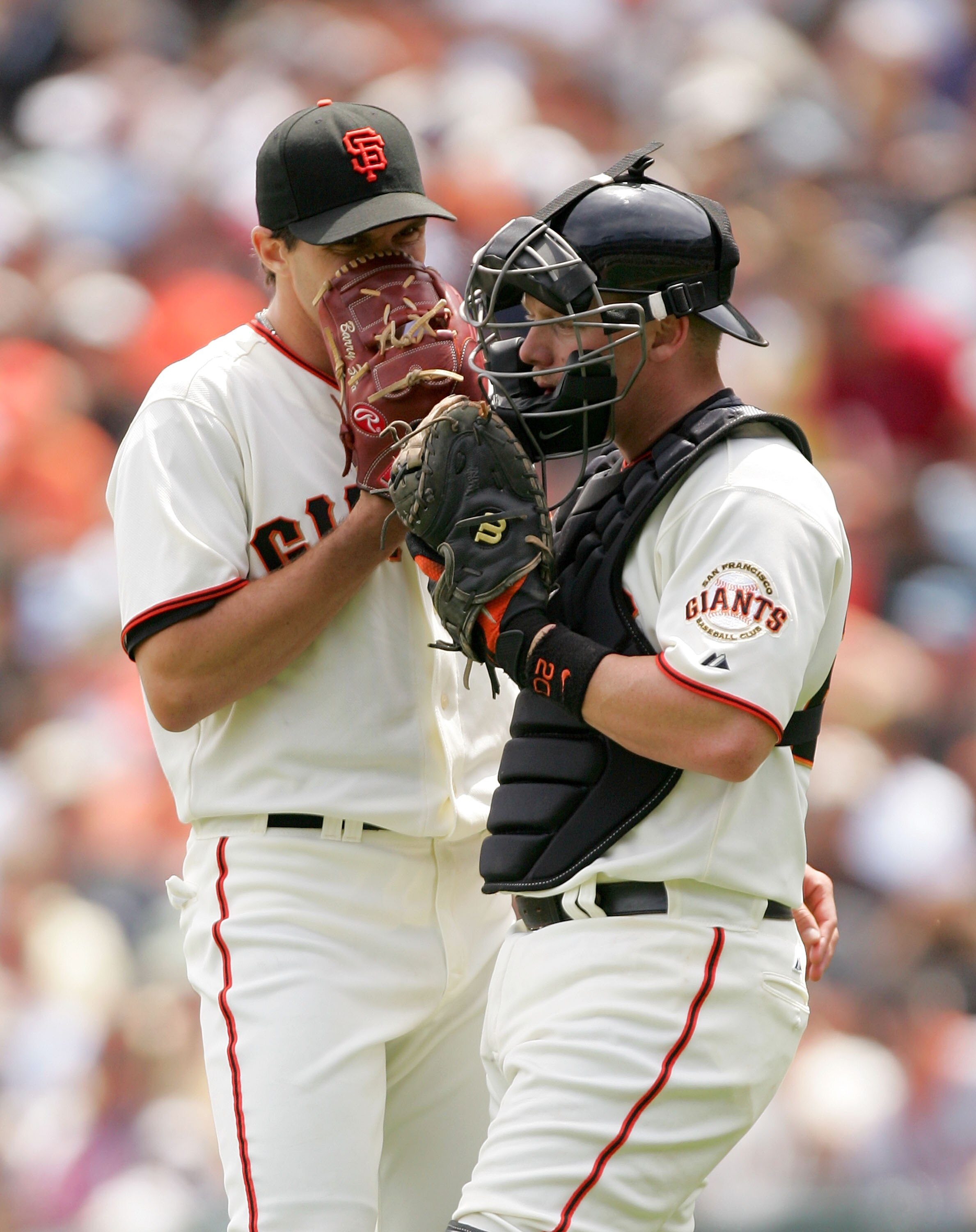 SAN FRANCISCO - MAY 13:  Catcher Steve Holm #20 speaks with Barry Zito #75 of the San Francisco Giants during their game against the Washington Nationals at AT&T Park on May 13, 2009 in San Francisco, California.  (Photo by Ezra Shaw/Getty Images)