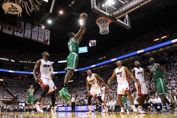 MIAMI, FL - MAY 11:  Jeff Green #8 of the Boston Celtics dunks over Juwan Howard #5 and Dwyane Wade #3 of the Miami Heat during Game Five of the Eastern Conference Semifinals of the 2011 NBA Playoffs at American Airlines Arena on May 11, 2011 in Miami, Fl