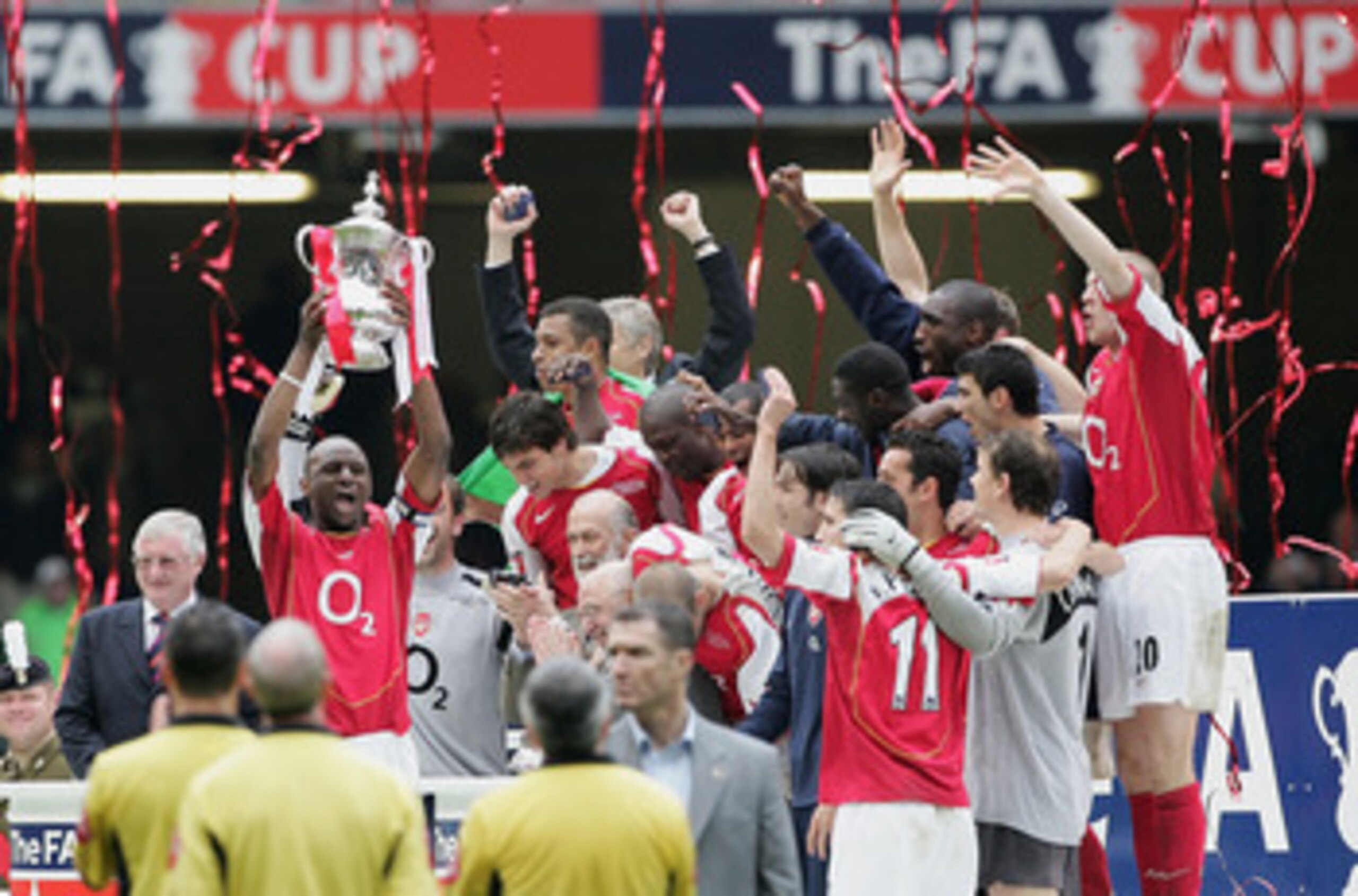 CARDIFF, UNITED KINGDOM - MAY 21: Arsenal captain, Patrick Vieira, holds the trophy aloft as team mates celebrate after winning the FA Cup Final between Arsenal and Manchester United 5-4 on penalty's at The Millennium Stadium on May 21, 2005 in Cardiff, W