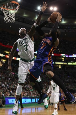 BOSTON, MA - APRIL 17:  Jermaine O'Neal #7 of the Boston Celtics tries to block a shot by Carmelo Anthony #7 of the New York Knicks in Game One of the Eastern Conference Quarterfinals in the 2011 NBA Playoffs on April 17, 2011 at the TD Garden in Boston,