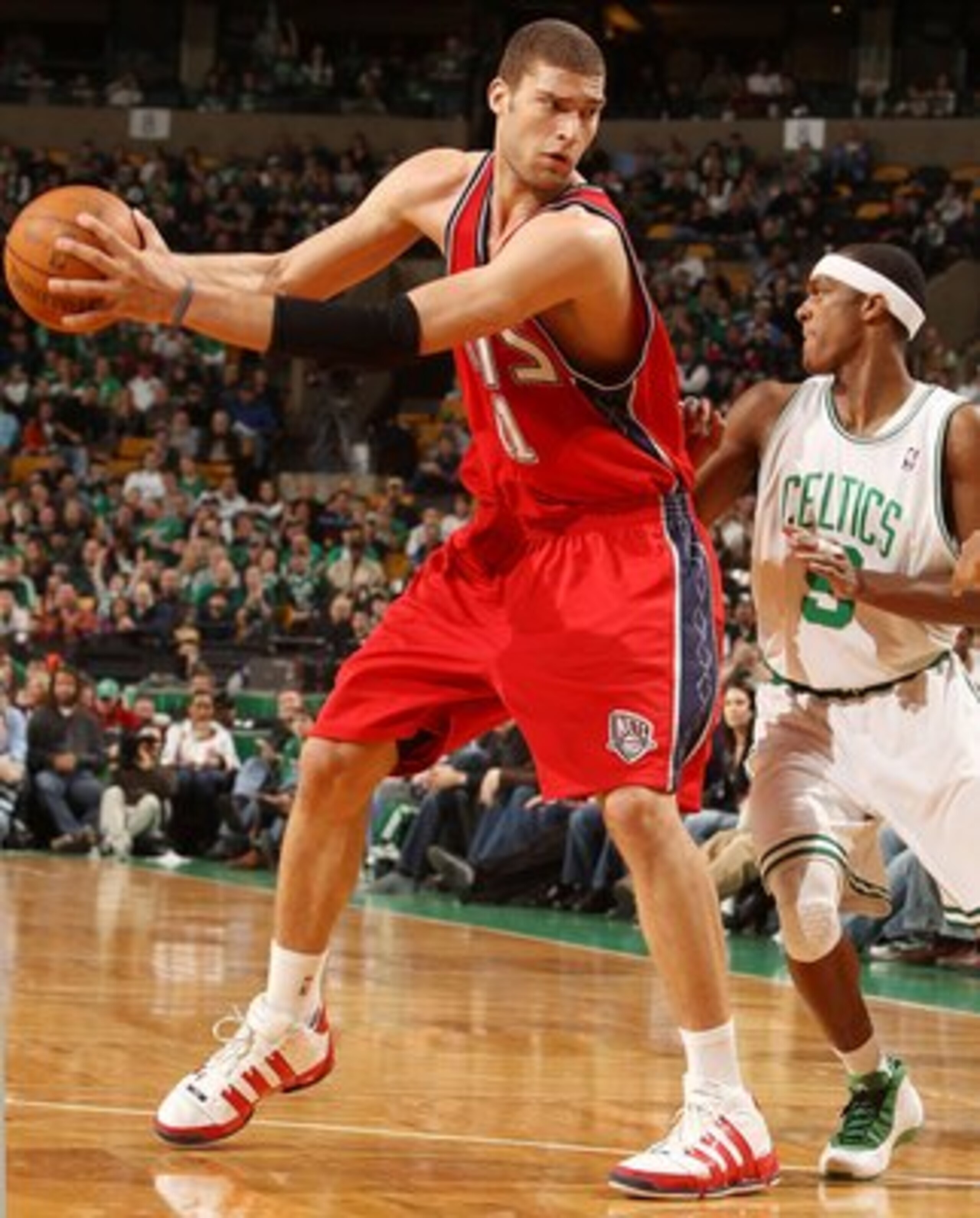 BOSTON - FEBRUARY 27: Brook Lopez #11 of the New Jersey Nets looks to pass as Rajon Rondo #9 of the Boston Celtics defends at the TD Garden on February 27, 2010 in Boston, Massachusetts. The Nets defeated the Celtics 104-96. NOTE TO USER: User expressl BOSTON - FEBRUARY 27: Brook Lopez #11 of the New Jersey Nets looks to pass as Rajon Rondo #9 of the Boston Celtics defends at the TD Garden on February 27, 2010 in Boston, Massachusetts. The Nets defeated the Celtics 104-96. NOTE TO USER: User expressl