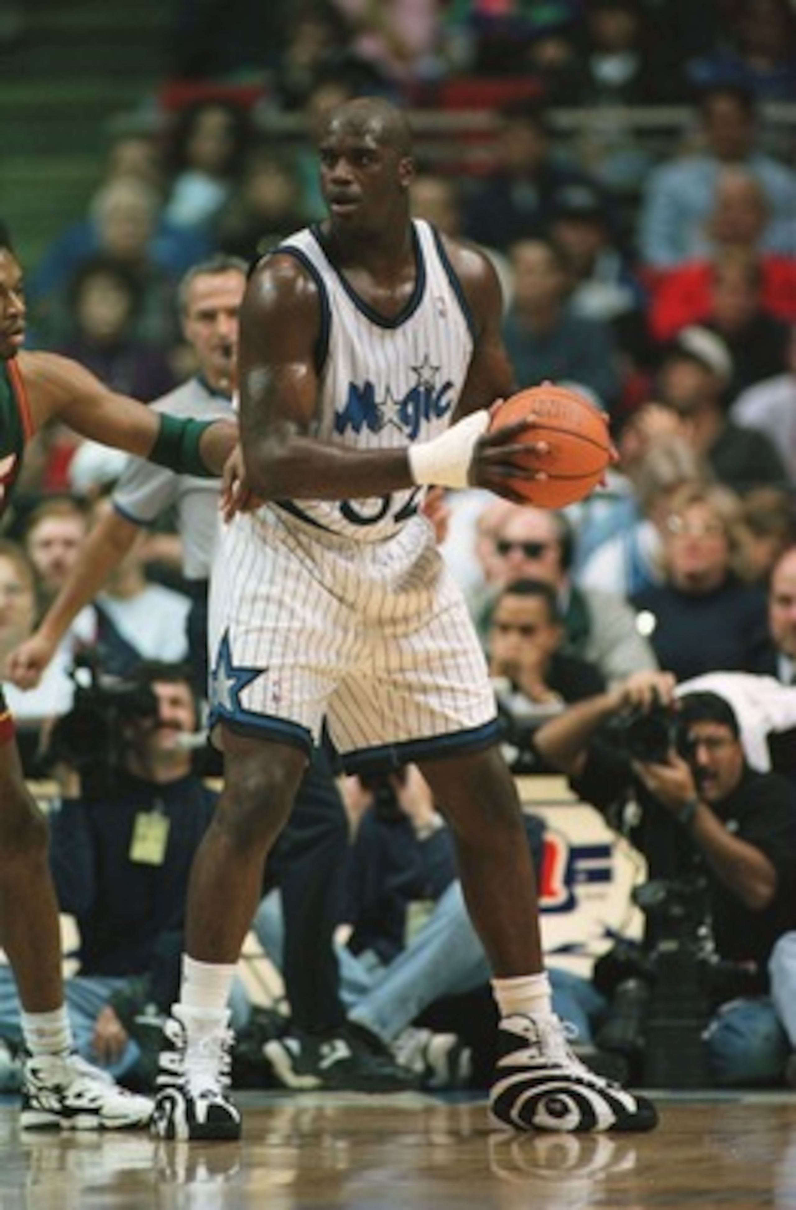 5 Jan 1996: Center Shaquille O''neal #32 of the Orlando Magic backs into Sam Perkins of the Seattle Supersonics during the Magic 115-93 win over the Seattle Supersonics at Orlando Arena in Orlando, Florida. Mandatory Credit: Allsport USA/ALLSPORT 5 Jan 1996: Center Shaquille O''neal #32 of the Orlando Magic backs into Sam Perkins of the Seattle Supersonics during the Magic 115-93 win over the Seattle Supersonics at Orlando Arena in Orlando, Florida. Mandatory Credit: Allsport USA/ALLSPORT