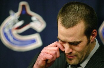 VANCOUVER - MARCH 10:   Todd Bertuzzi of the Vancouver Canucks talks to the media prior to start of the  the Canuck's NHL game against the Minnesota Wild at General Motors Place on March 10, 2004 in Vancouver, Canada.  Bertuzzi faced an NHL disciplinary h