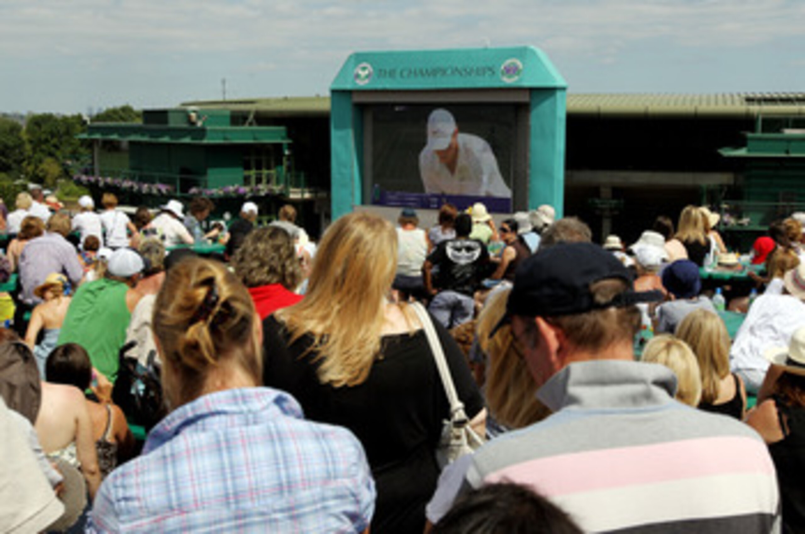 LONDON, ENGLAND - JULY 04:  Tennis fans watch the big screen on Henman Hill during the Men's Singles Final match between Rafael Nadal of Spain and Tomas Berdych of Czech Republic on Day Thirteen of the Wimbledon Lawn Tennis Championships at the All Englan