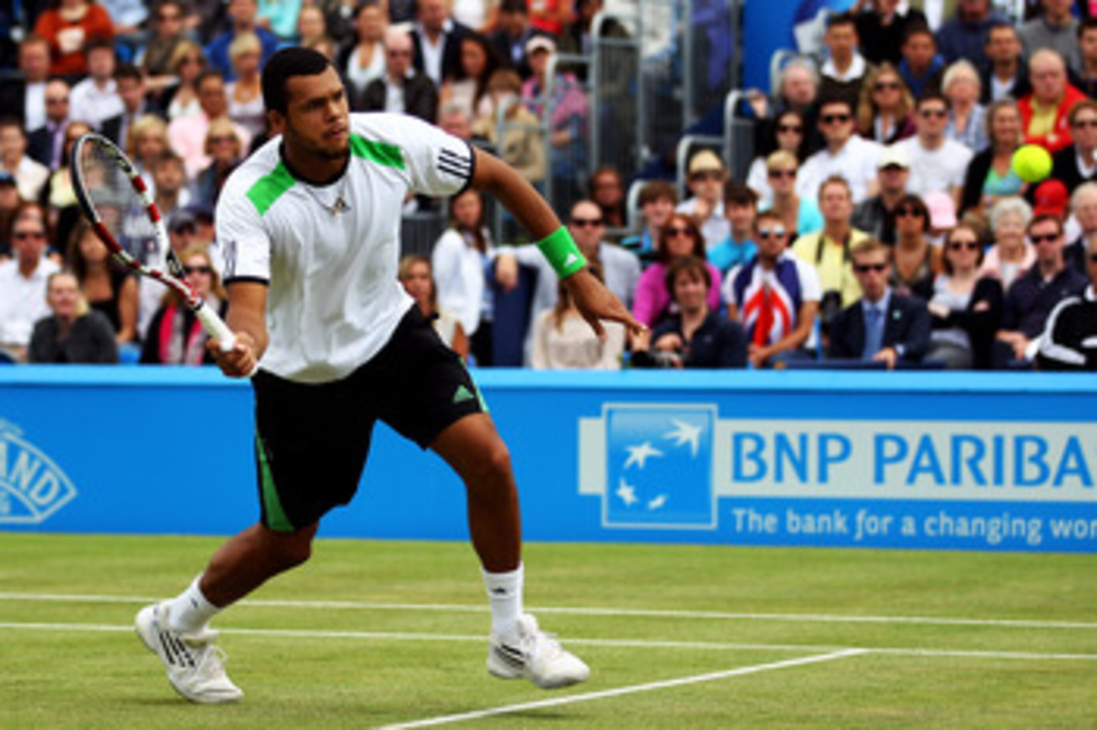 LONDON, ENGLAND - JUNE 13: Jo-Wilfred Tsonga of France eyes the ball during his Men's Singles final against Andy Murray of Great Britain on day eight of the AEGON Championships at Queens Club on June 13, 2011 in London, England. (Photo by Clive Brunskil LONDON, ENGLAND - JUNE 13: Jo-Wilfred Tsonga of France eyes the ball during his Men's Singles final against Andy Murray of Great Britain on day eight of the AEGON Championships at Queens Club on June 13, 2011 in London, England. (Photo by Clive Brunskil