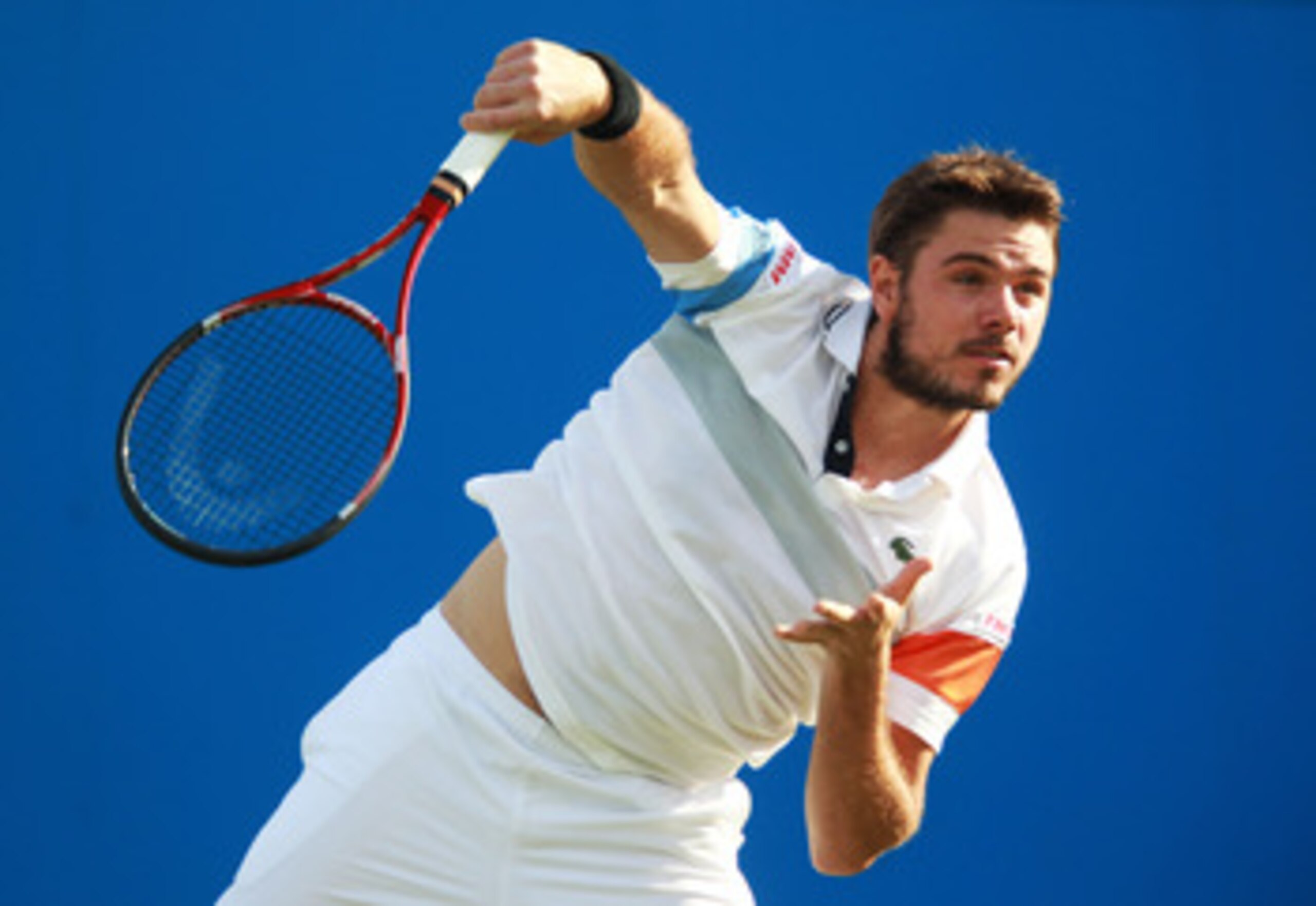 LONDON, ENGLAND - JUNE 07:  Stanislas Wawrinka of Switzerland serves during his Men's Singles first round match against James Ward of Great Britain on day two of the AEGON Championships at Queens Club on June 7, 2011 in London, England.  (Photo by Julian 