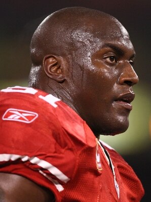 SAN FRANCISCO - DECEMBER 14:  Linebacker Takeo Spikes #51 of the San Francisco 49ers looks on before taking on the Arizona Cardinals at Candlestick Park on December 14, 2009 in San Francisco, California. (Photo by Jed Jacobsohn/Getty Images)