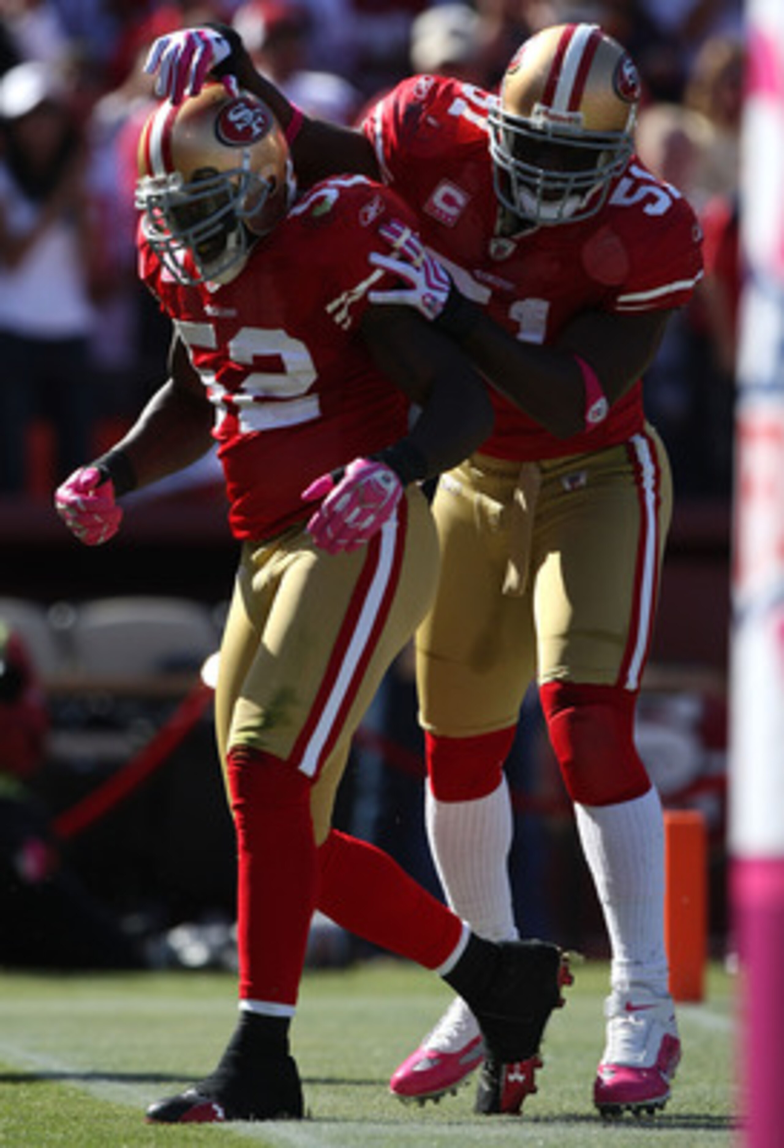 SAN FRANCISCO - OCTOBER 04:  Patrick Willis #52 of the San Francisco 49ers celebrates with Takeo Spikes #51 after returning an interception for a touchdown against the St. Louis Rams during an NFL game on October 4, 2009 at Candlestick Park in San Francis
