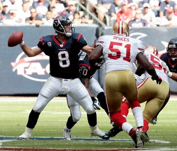 HOUSTON - OCTOBER 25:  Quarterback Matt Schaub #8 of the Houston Texans looks downfield for a receiver as linebacker Takeo Spikes #51 of the San Francisco 49ers applies pressure at Reliant Stadium on October 25, 2009 in Houston, Texas.  (Photo by Bob Leve