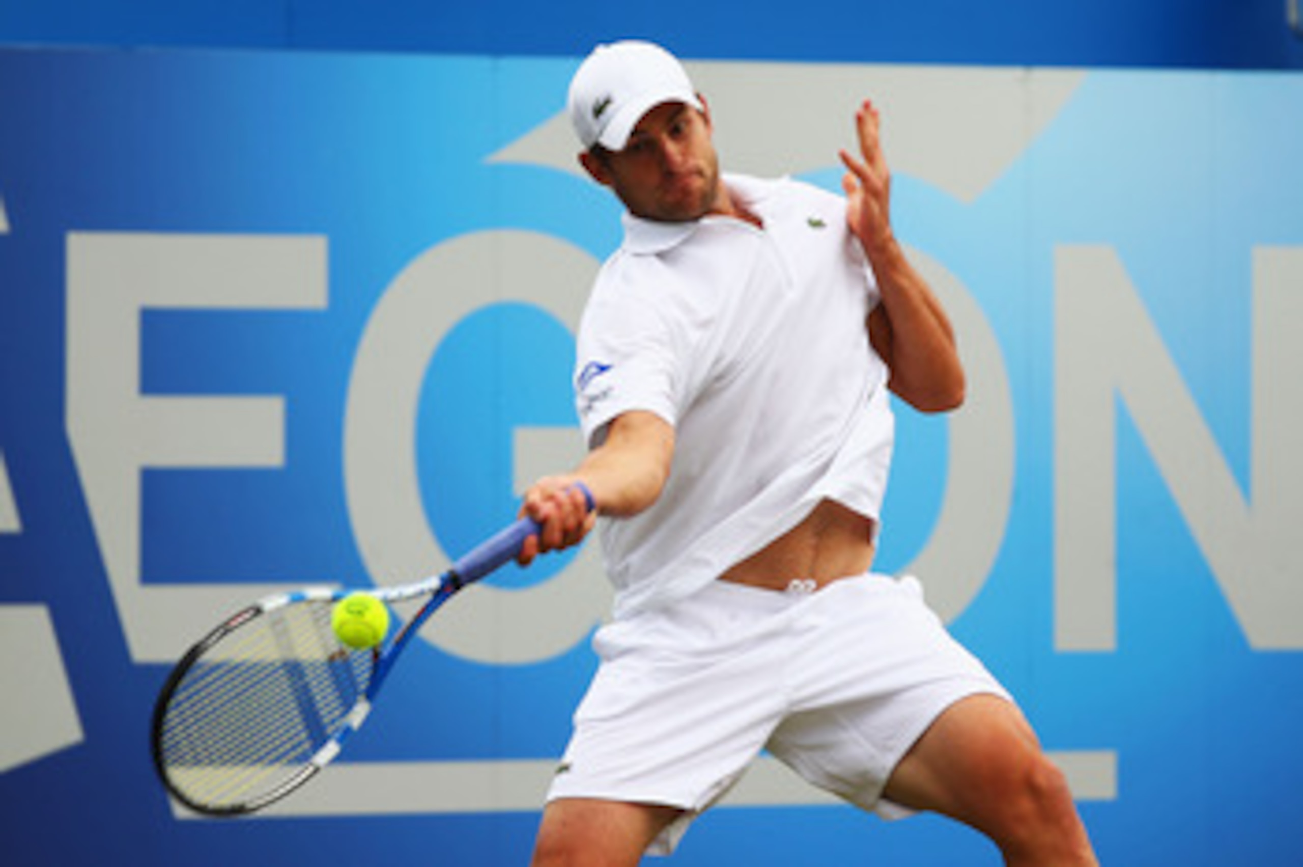 LONDON, ENGLAND - JUNE 10:  Andy Roddick of the United States hits a return during his Men's Singles quarter final match against Fernando Verdasco of Spain on day five of the AEGON Championships at Queens Club on June 10, 2011 in London, England.  (Photo 
